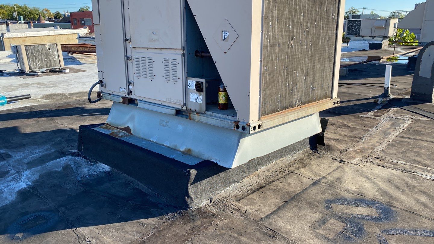 Commercial Roofing Repair using new Flashing by Alpha Design Services