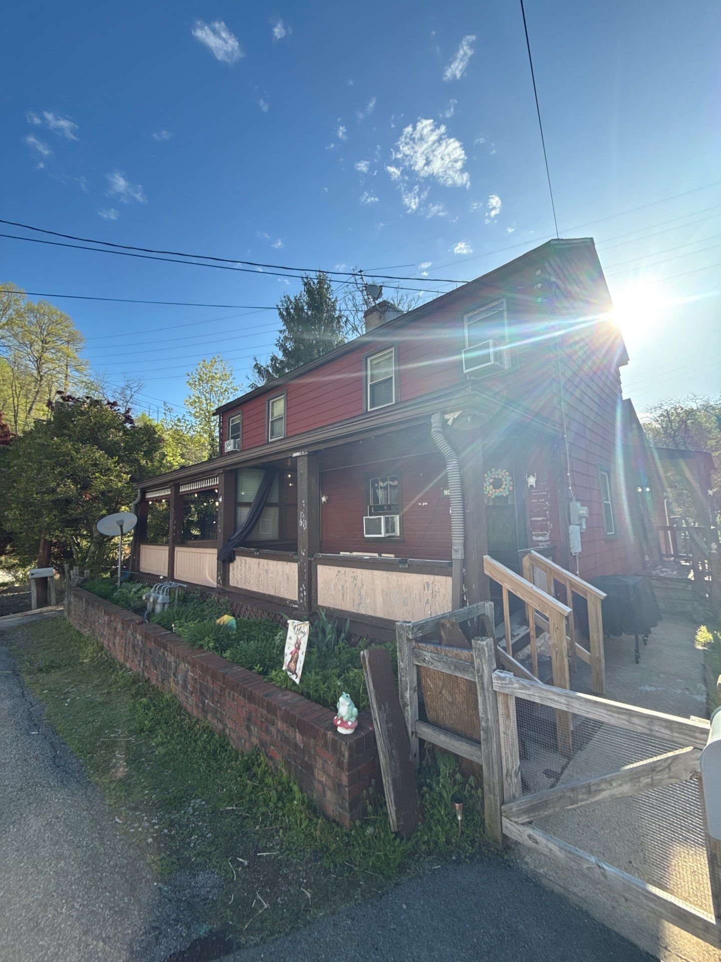 Roof sunspace deck  by Cousins Roofing Siding & Decks