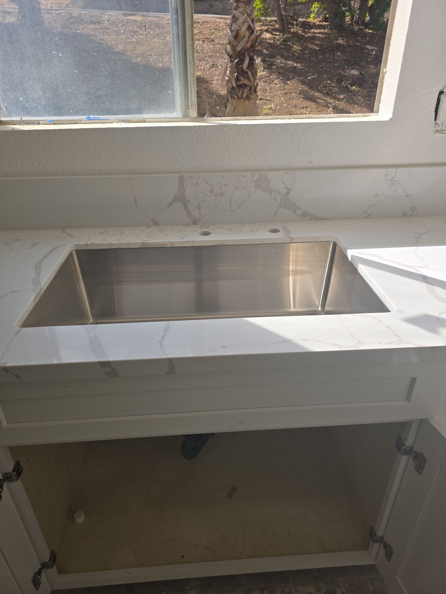 Scope of Work: Installation of Shower, Toilet, Plumbing, Kitchen Sink, and Fixtures by Us Plumbing 