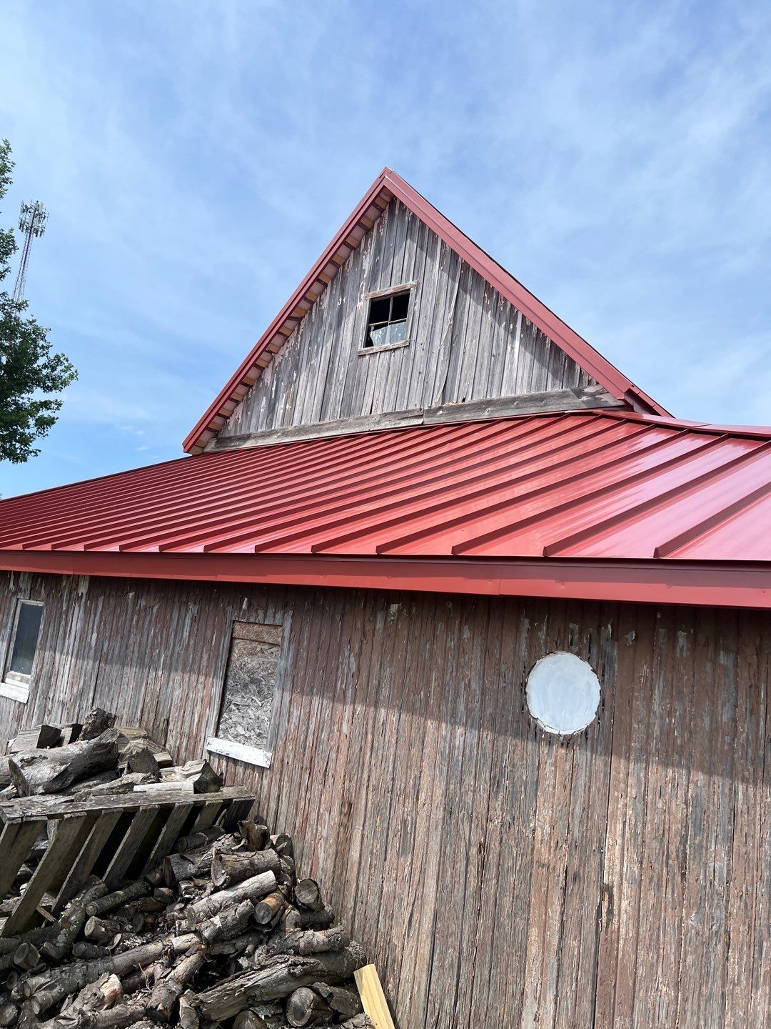 Residential Roofing Installation using Standing Seam Metal - Barn Red by RoofX 