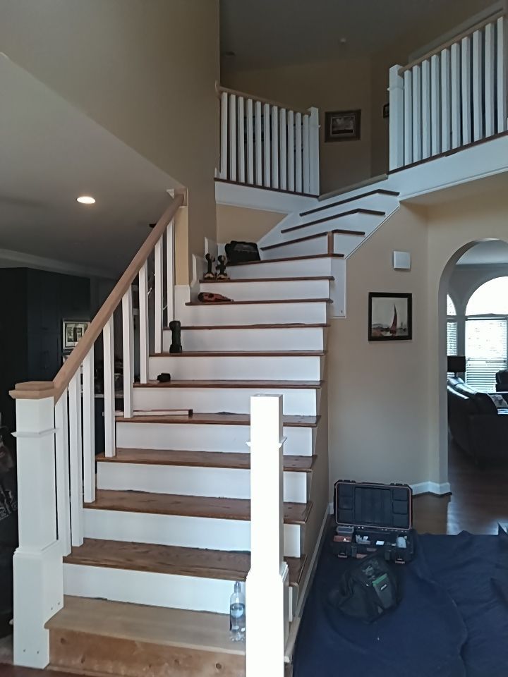 Stairway Installation using Red oak modern railings by House Custom Carpentry, LLC