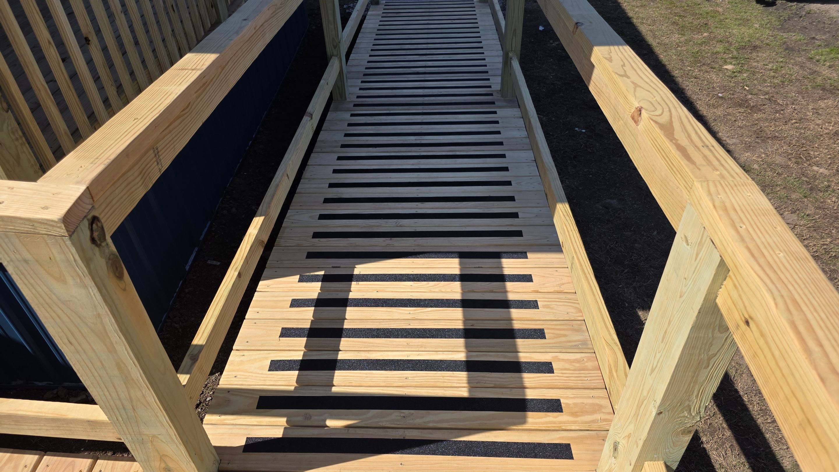 Covered Deck w/ ADA Ramp by In & Out Construction & Remodeling, LLC