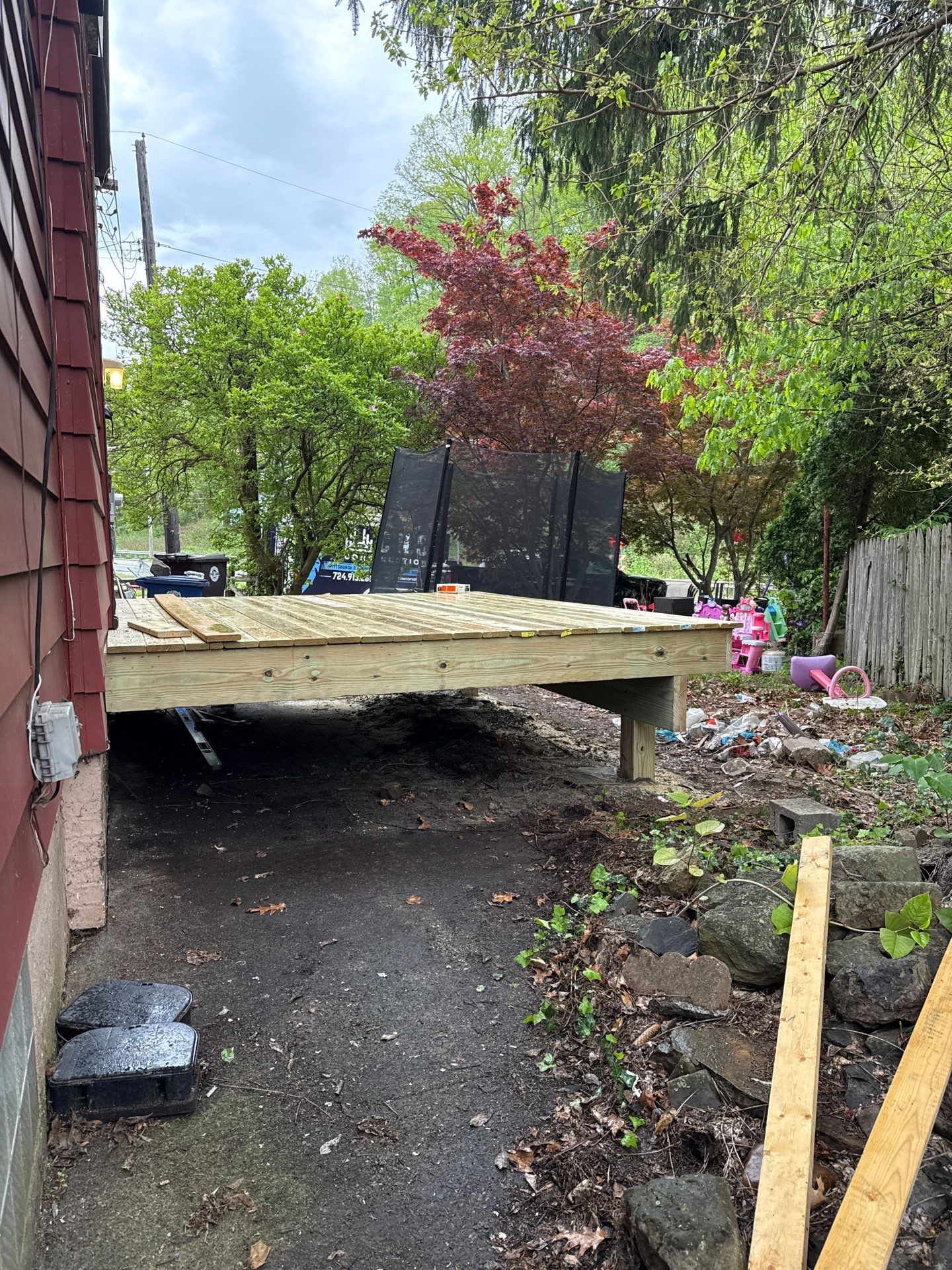 Roof sunspace deck  by Cousins Roofing Siding & Decks