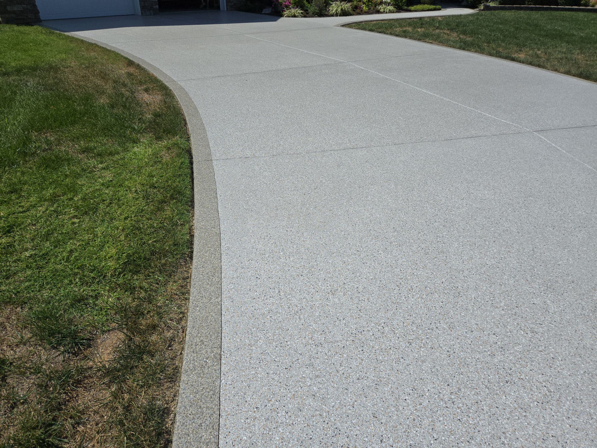 Driveway Improvement Using Claystone With Trail Mix Border! by Elite Floor Solutions