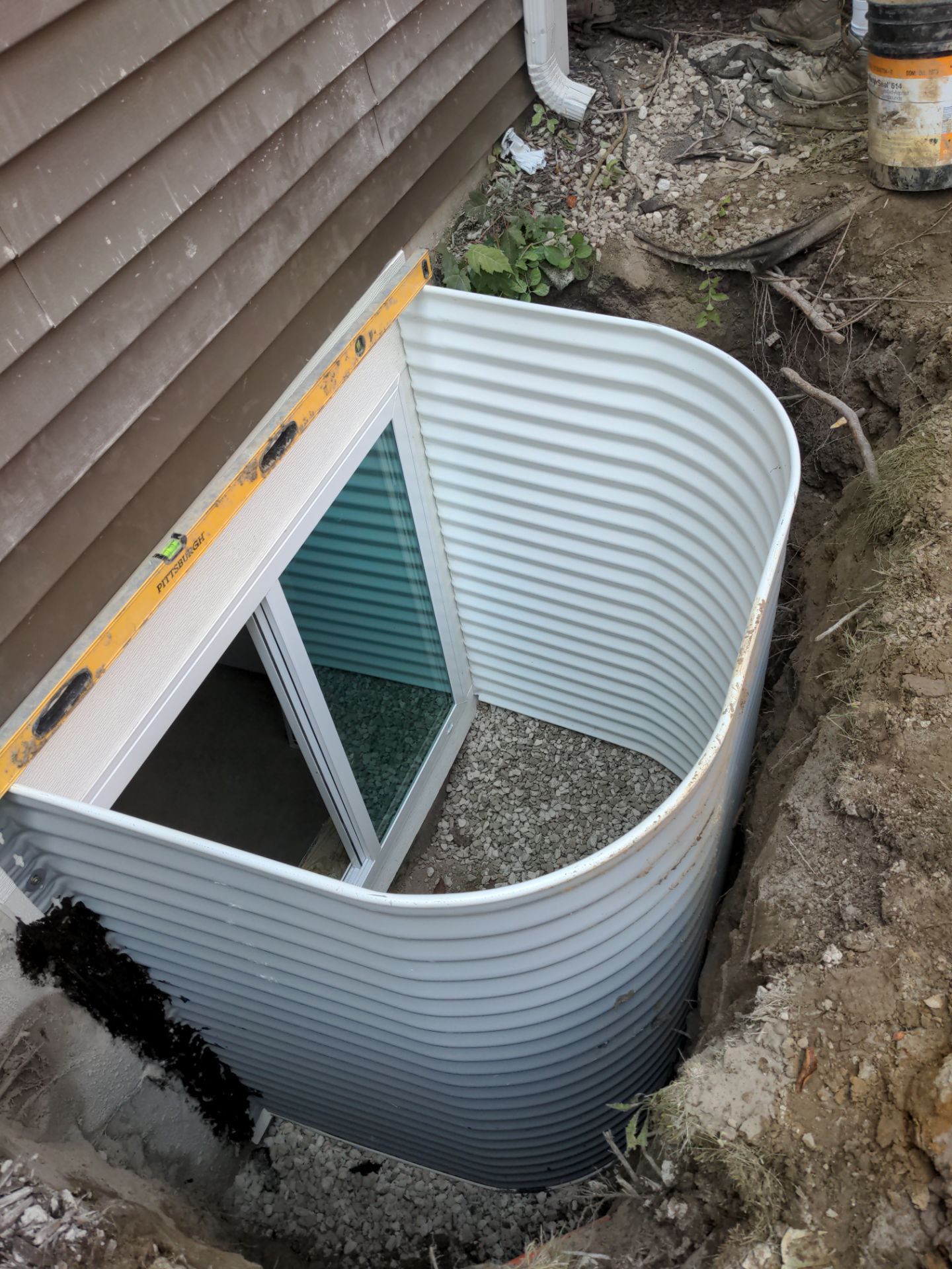 Interior Basement Waterproofing System and Egress Window Installation by Toledo Basement Repair 