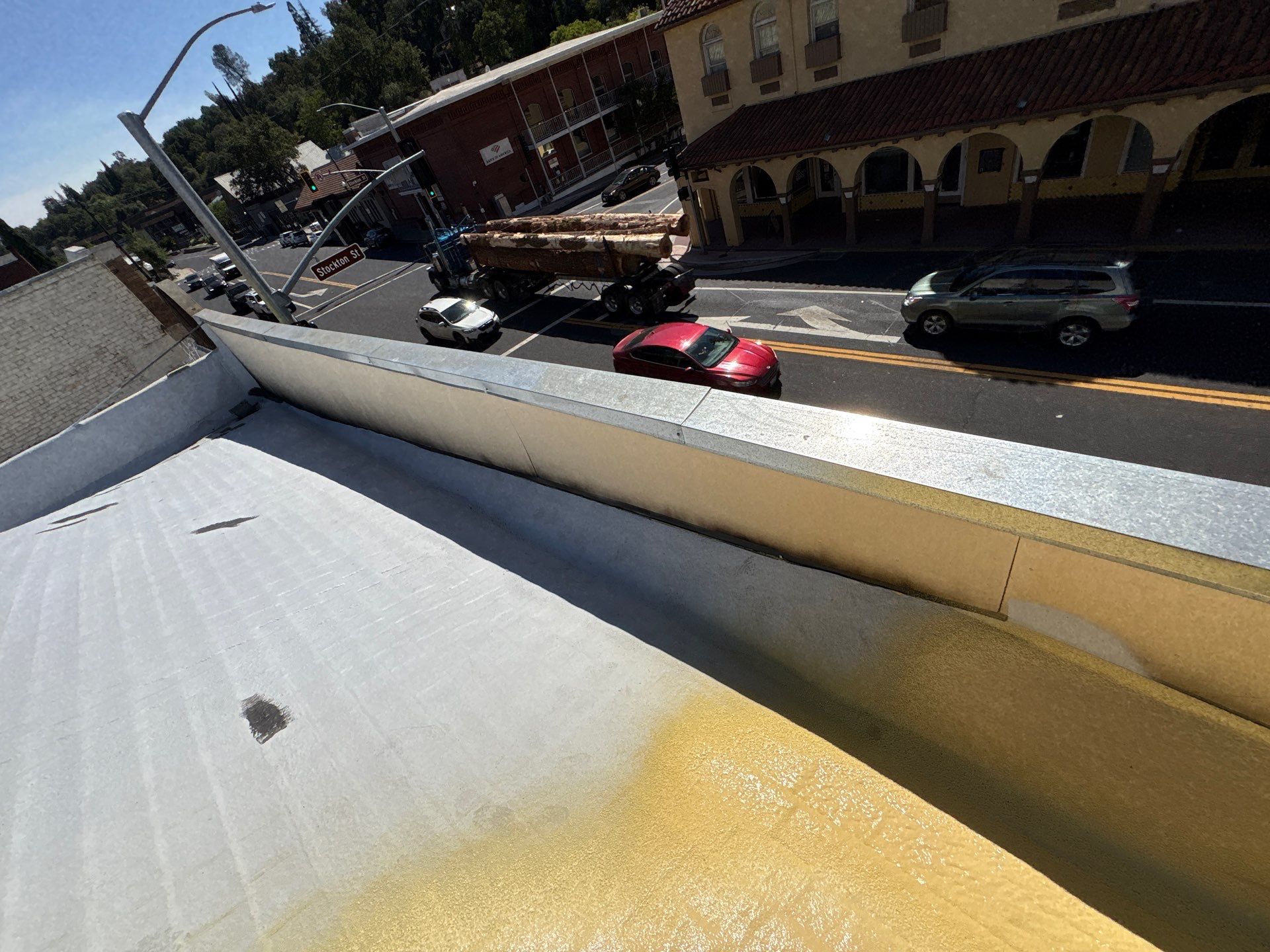 Foam and coatings on commercial roof by Straight Edge Roofing Inc