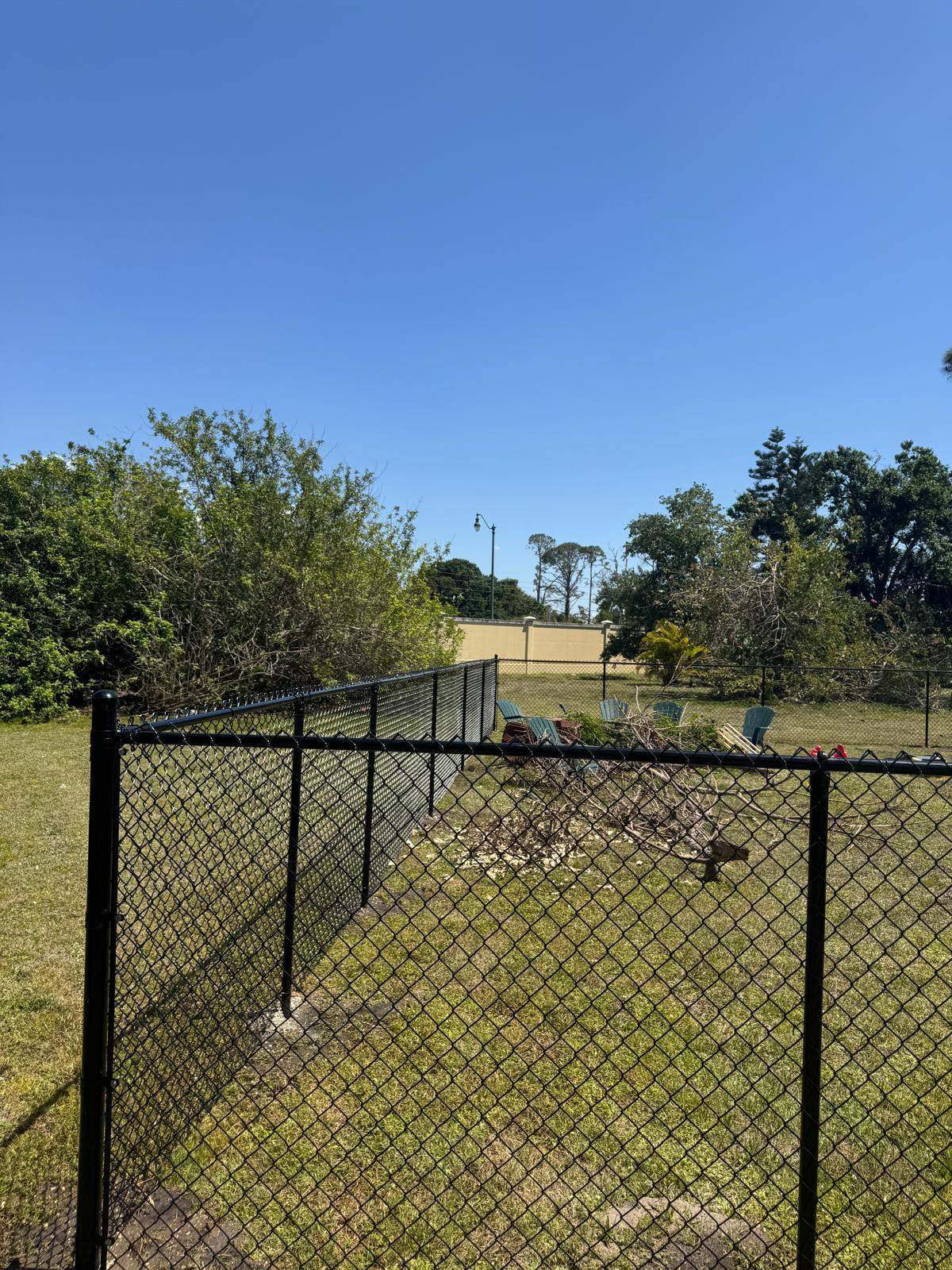 Black Chain Link Residential Backyard Fence Installation in North Port by True Fence LLC