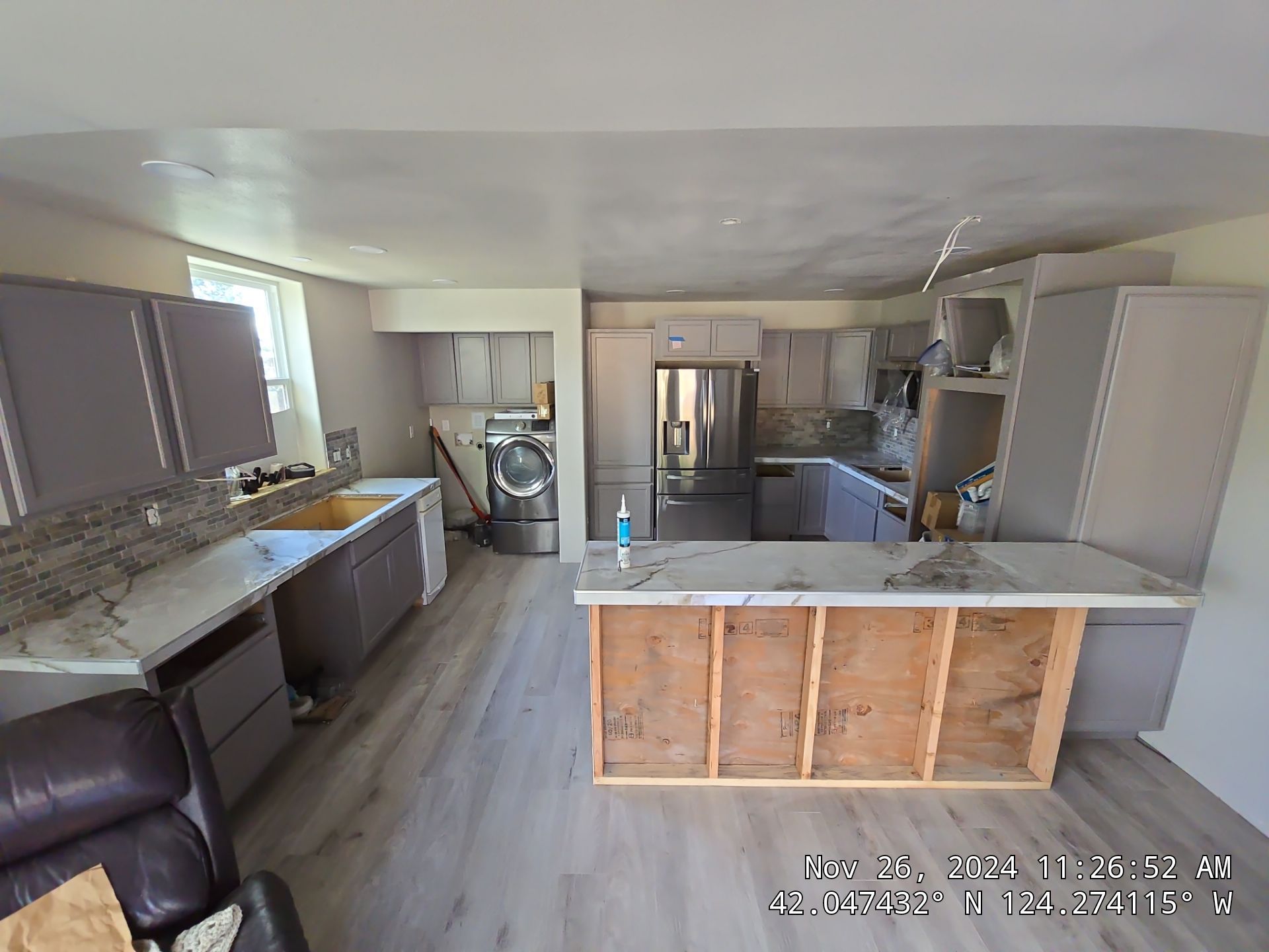 Marble Look Countertop and Stone Tile Backsplash Installation in Brookings by KMD Surfaces INC.