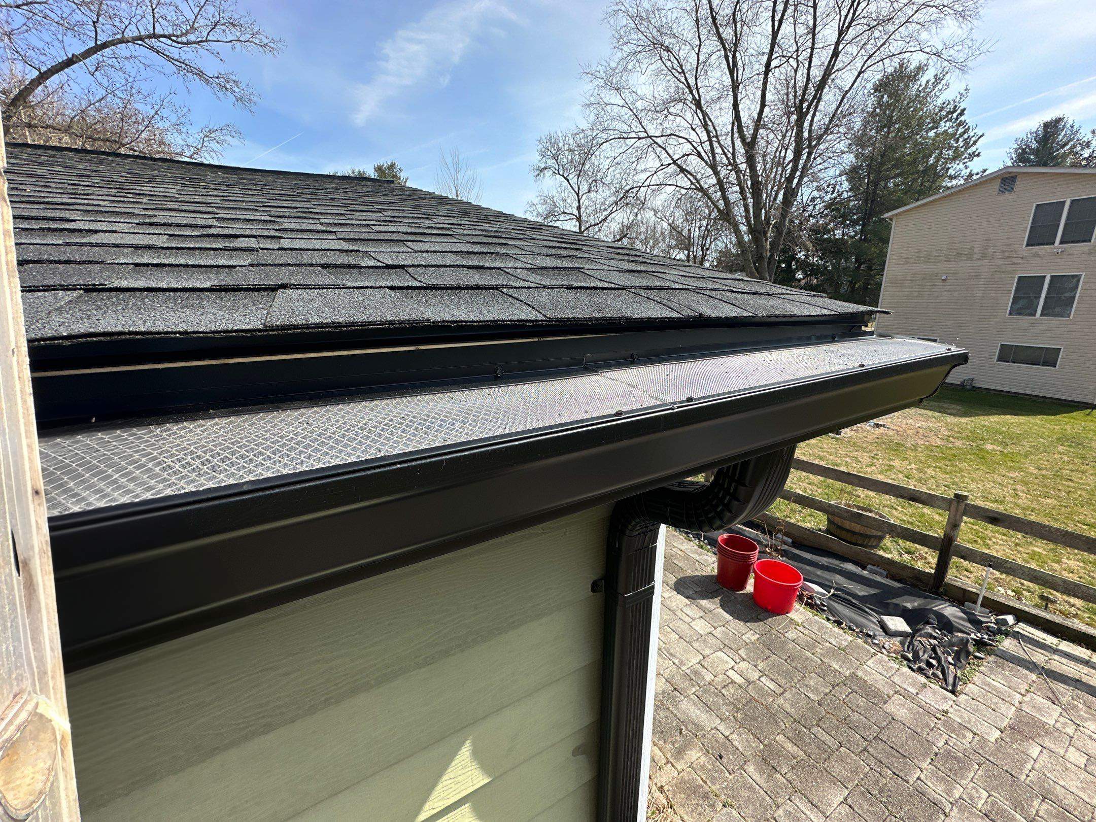 Blacked Out Gutters / Gutter Guards by American Home Contractors