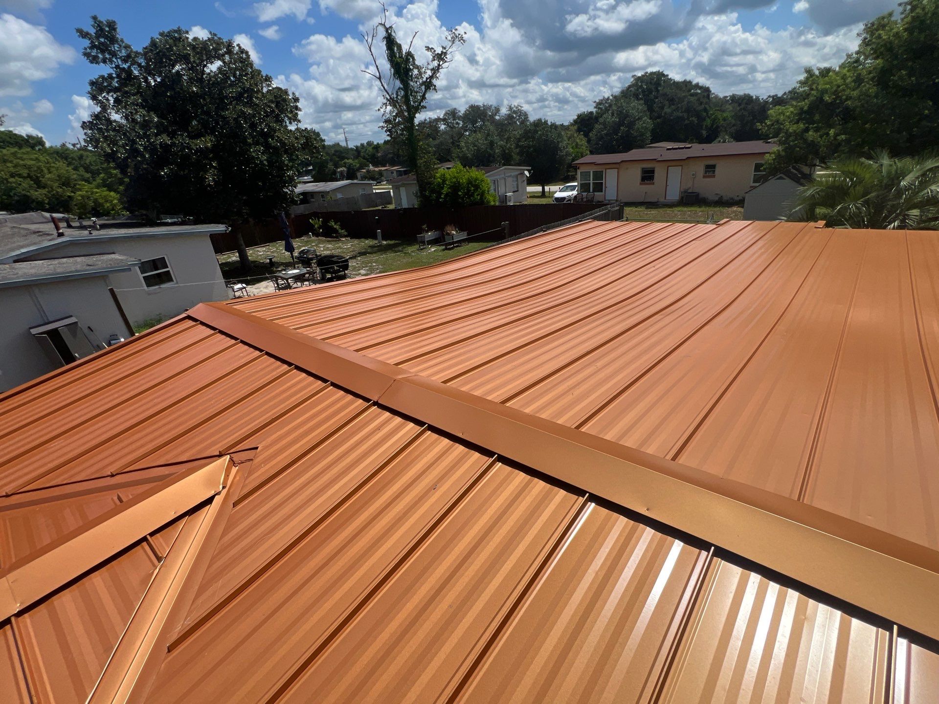 Standing Seam Metallic Copper Metal Roof Replacement in Deltona by Pinnacle Roofing Group