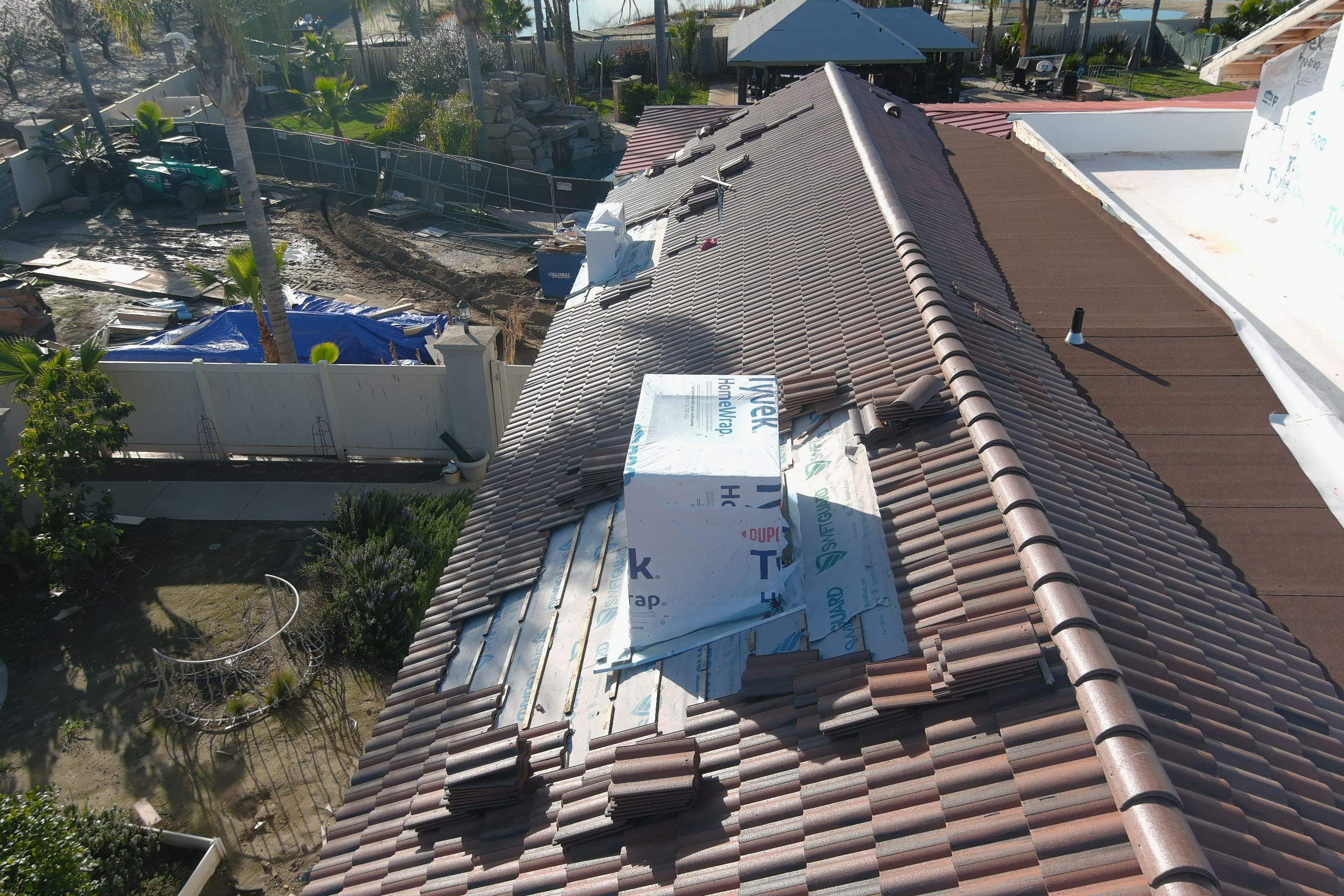 Tile, Metal, and TPO roofing project (new construction) by Straight Edge Roofing Inc