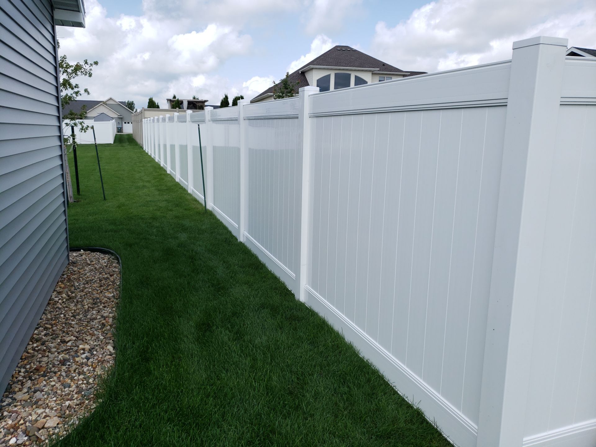 New Vinyl Privacy Fencing and Gates for Waterloo Residential Backyard by Perfect Picket Fence and Stain