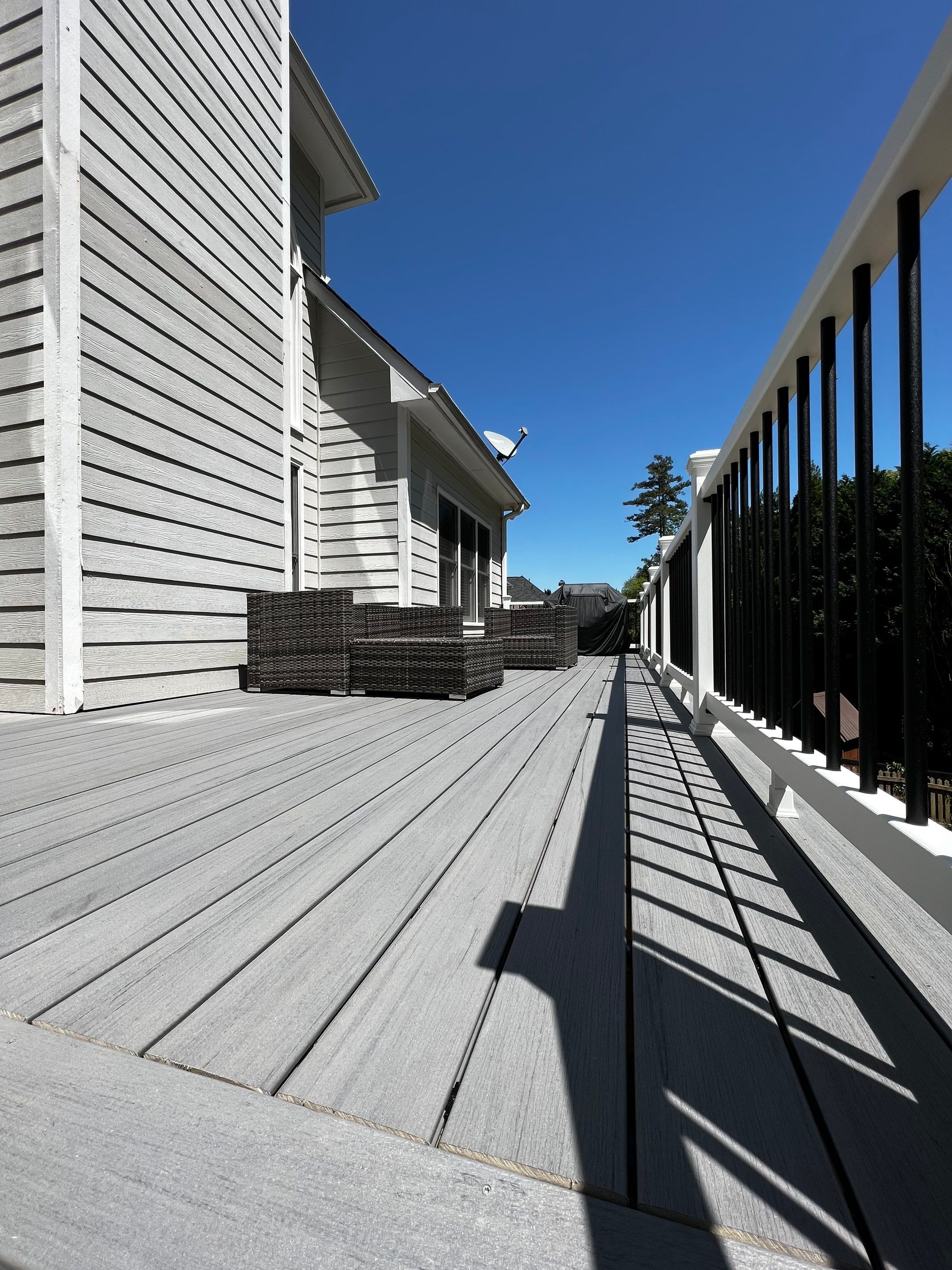 Elevated Grey Composite Deck Installation in Woodstock by Swift Home Renovations 
