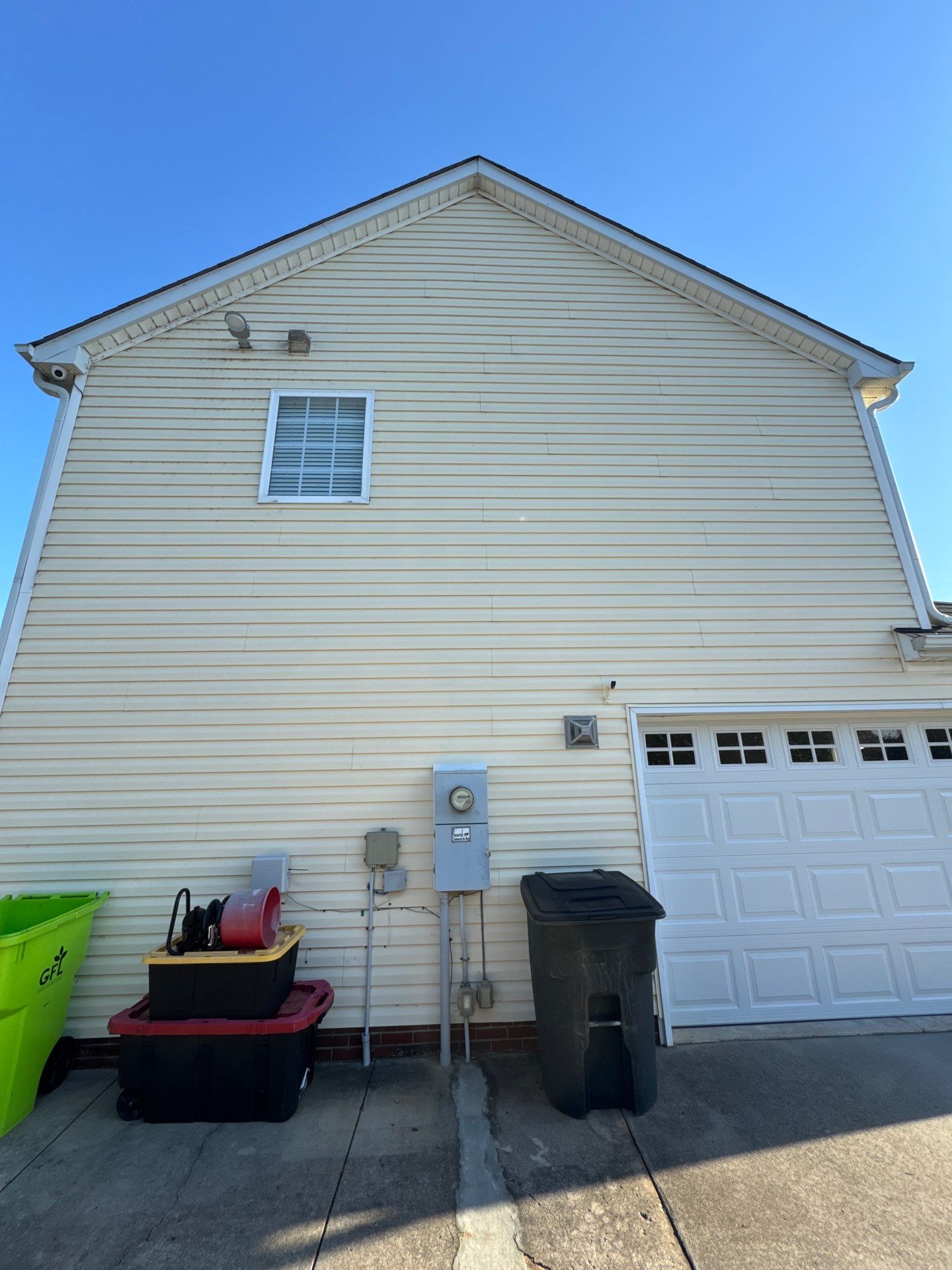 the service being done is cleaning the exterior siding of the house to remove dirt and grime buildup