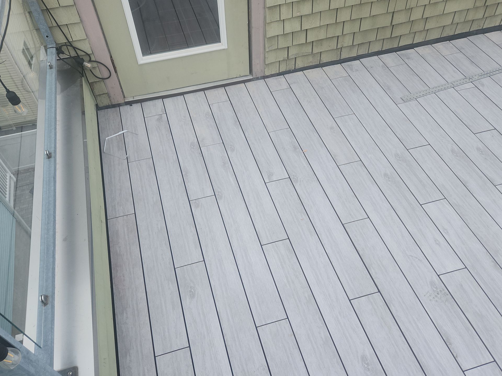 Deck Installation using Tanzite Stone Decking by A Plus Exterior