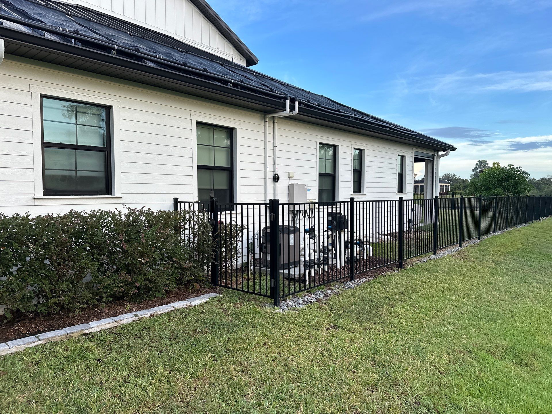 Complete Two-Story House Wash and Driveway Cleaning in Winding River Community, Bradenton, FL by Sunshine AquaWash