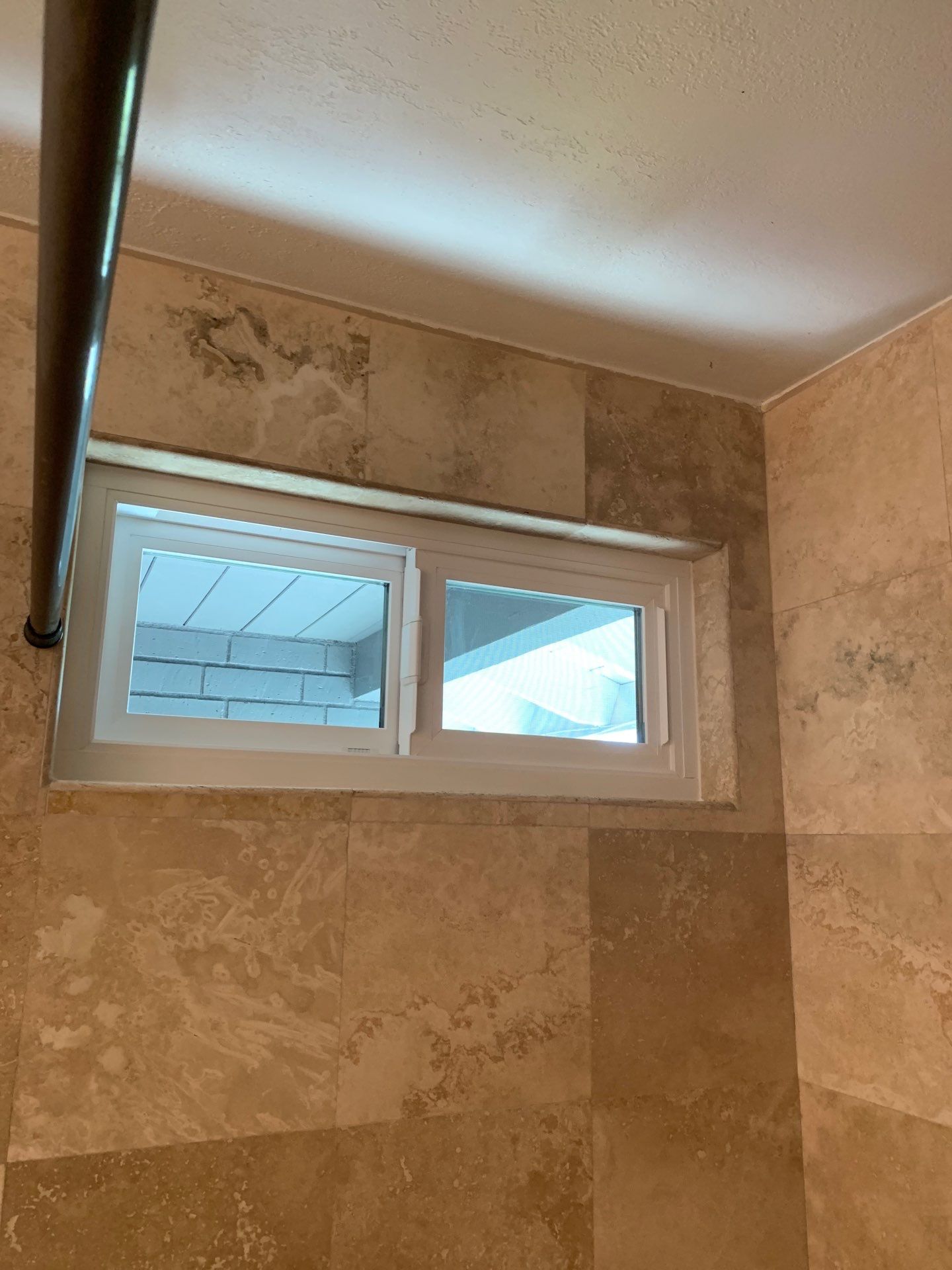 Window Installation using Milgard black vinyl windows by American Window Company
