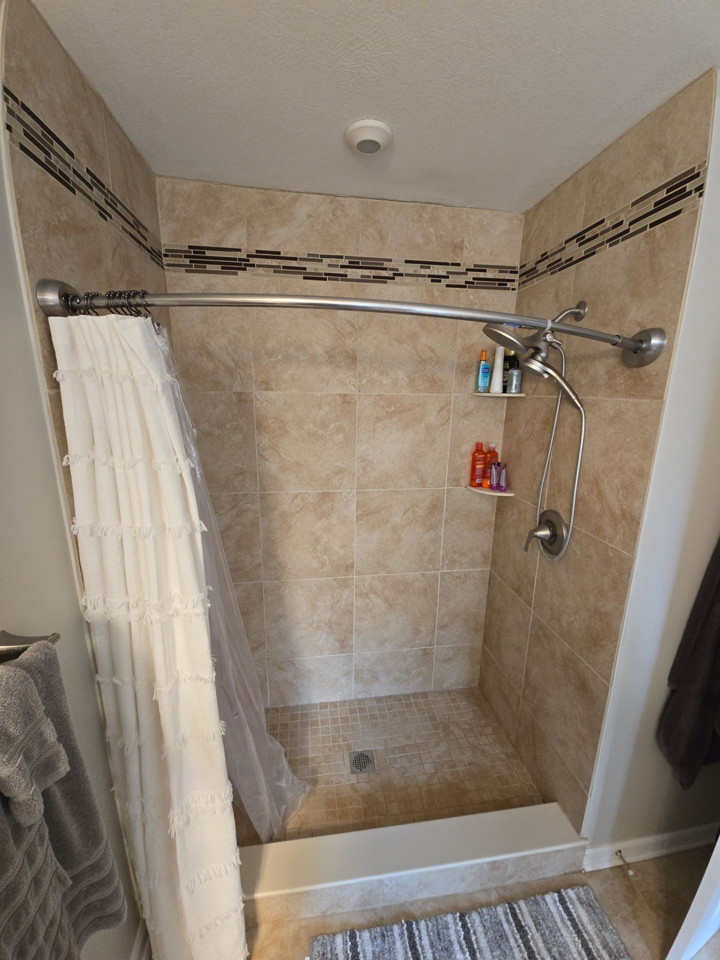 Custom Jacuzzi Walk-In Shower Remodel with Stone-Look Tile in Traverse City by Rainbow Seamless Systems
