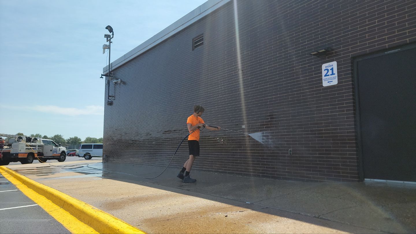 commercial pressure washing using Algaecide, soft wash soap by Northern Power Washing LLC.