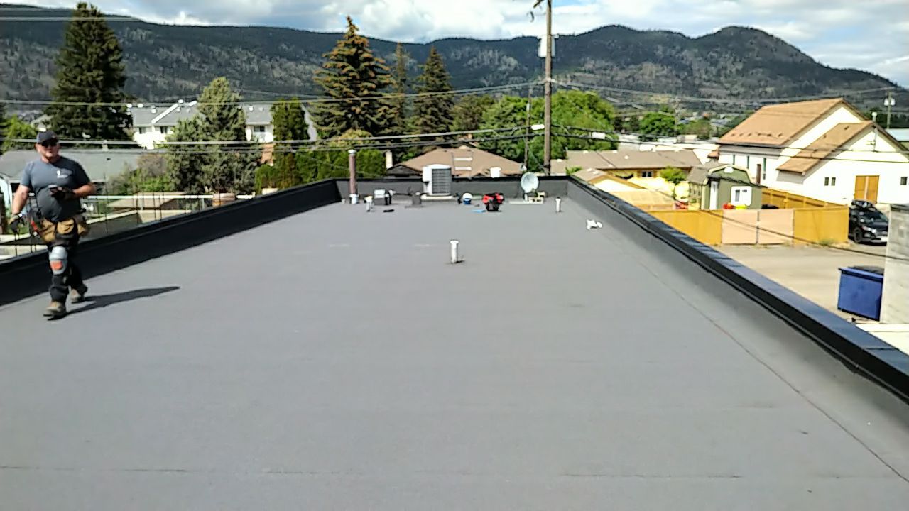 Commercial ReRoofing Installation using IKO 2ply sbs by Top Notch Roofing Inc