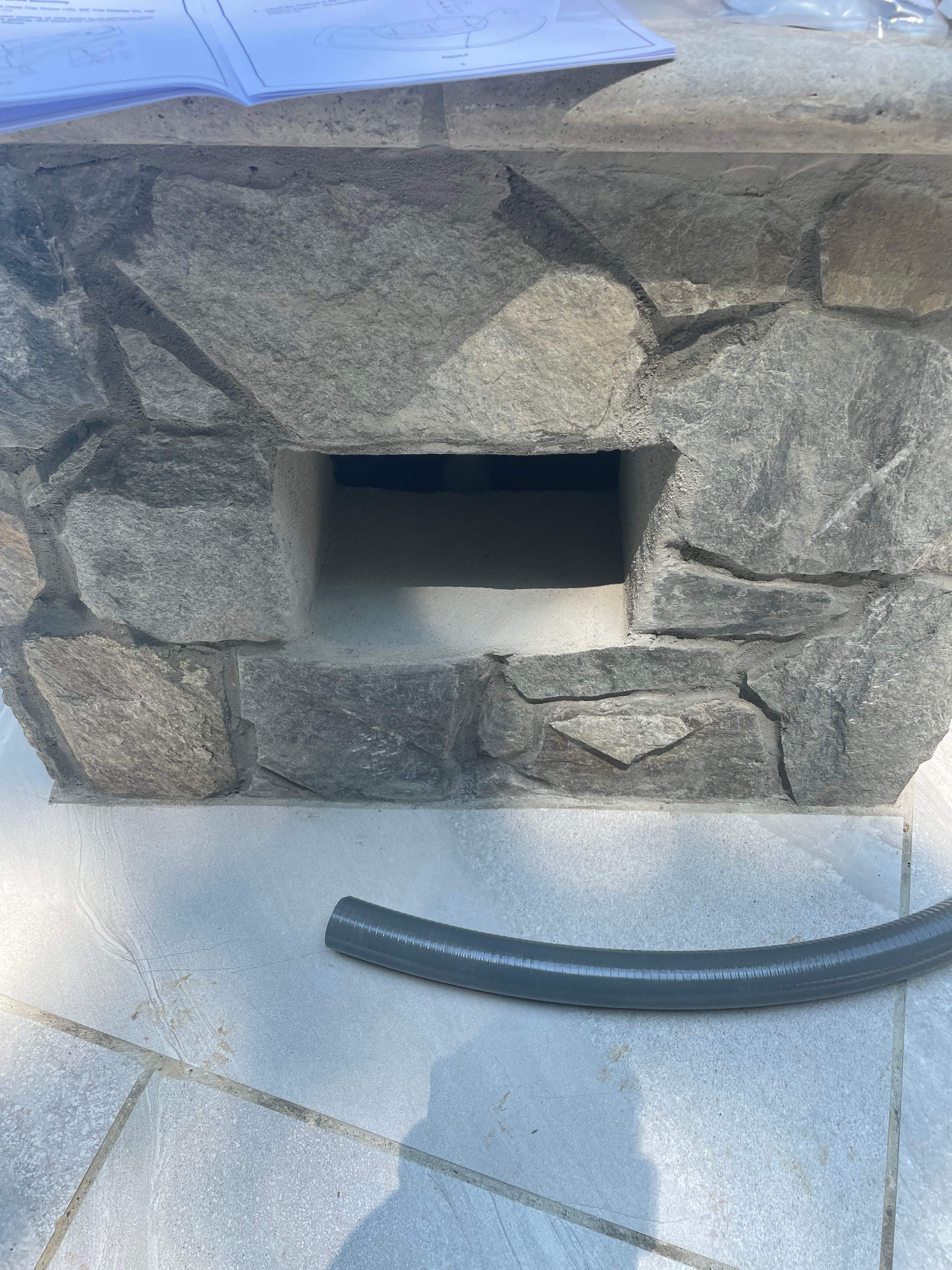 Pool Surround remodel with retaining walls, new waterfall and water slide by Fairfax Contractors, LLC