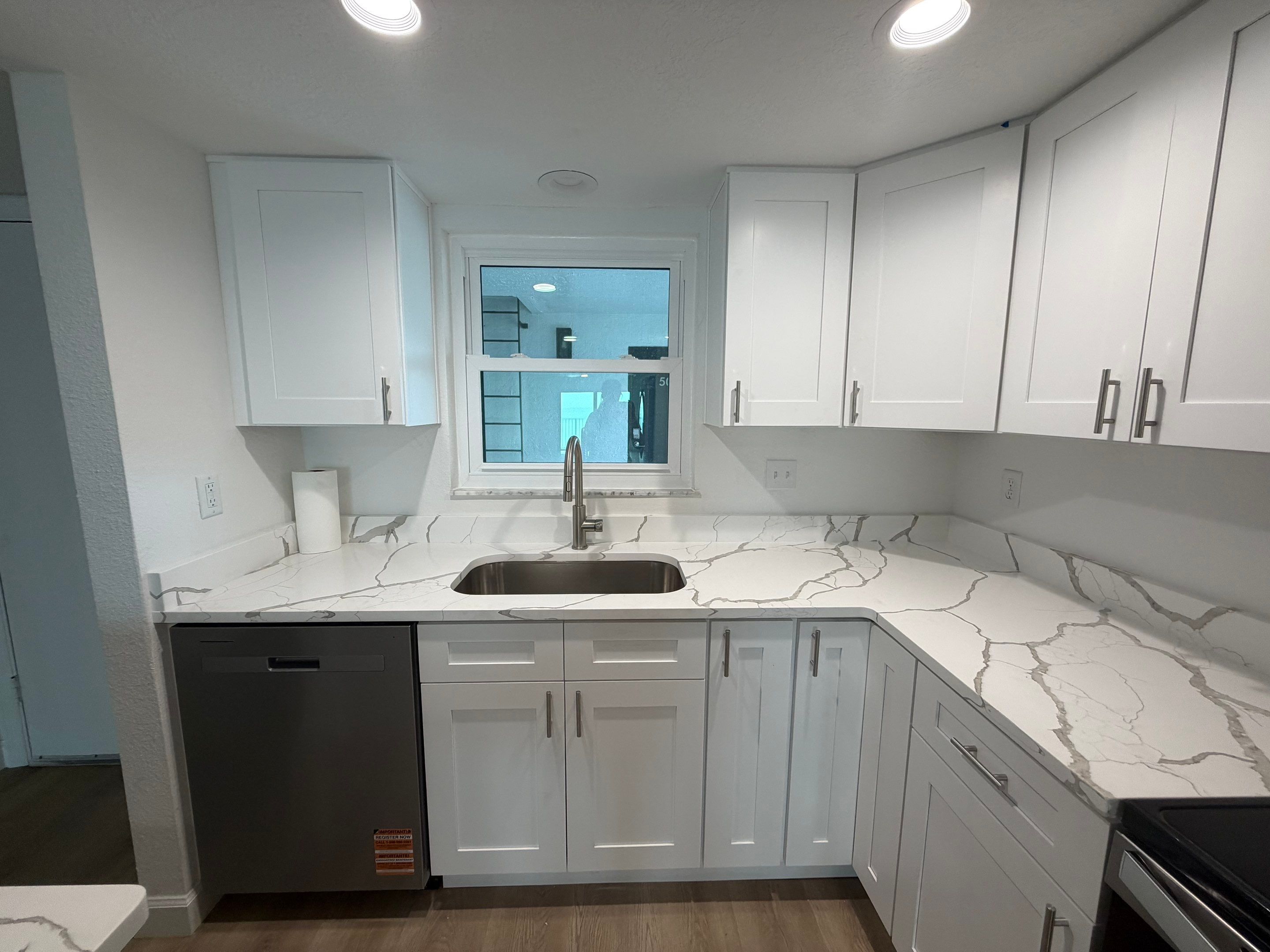 Full Condominium Remodel Featuring Aubrey Oak Flooring In Daytona Beach by Acies Renovations