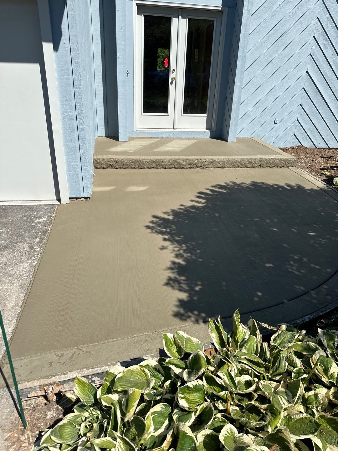 Charcoal Release Border with Broom Finish  by NG Masonry & Construction LLC