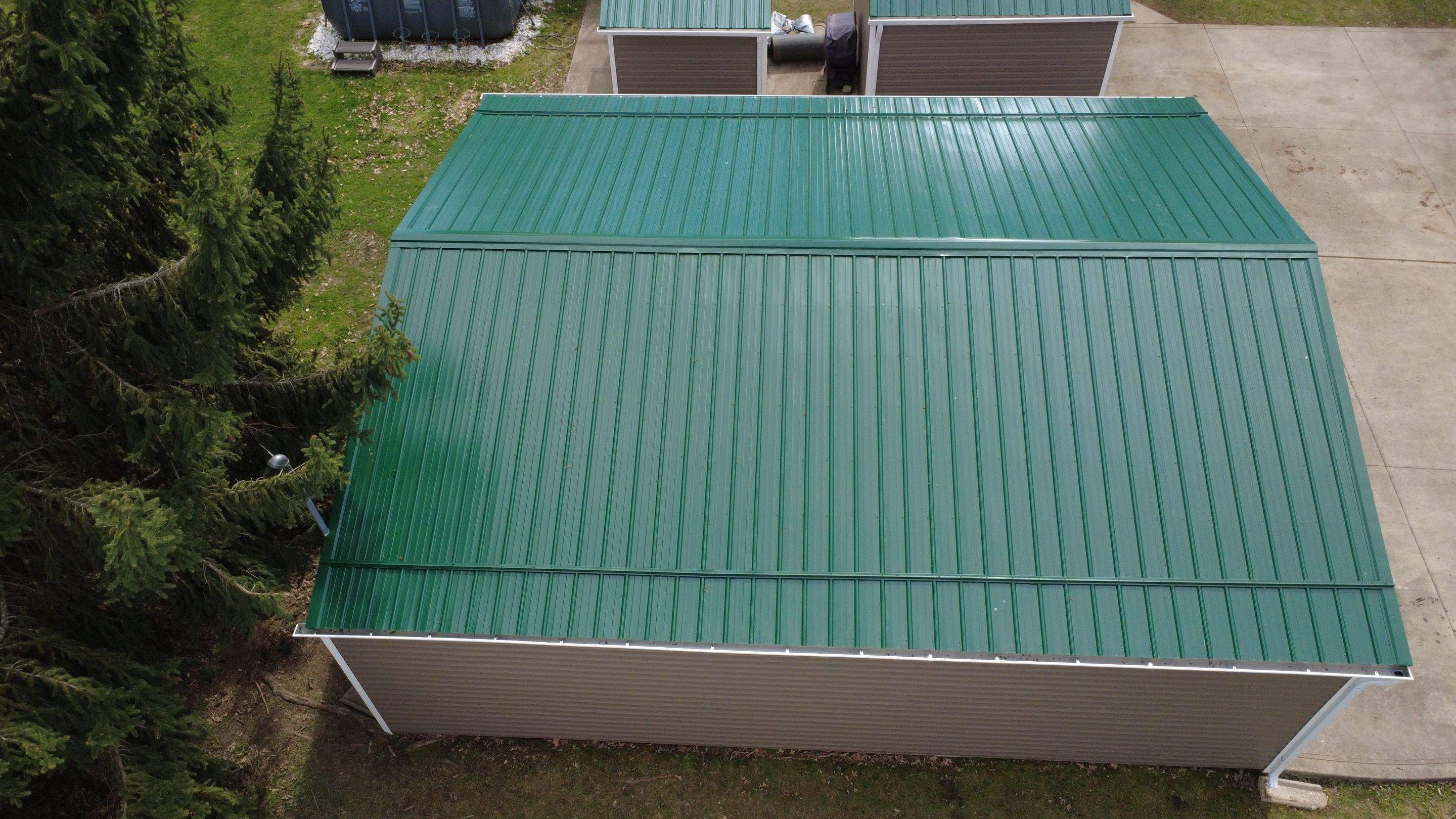 Green Metal Roof Installation and Exterior Renovation in Thornville by Canopy Contracting