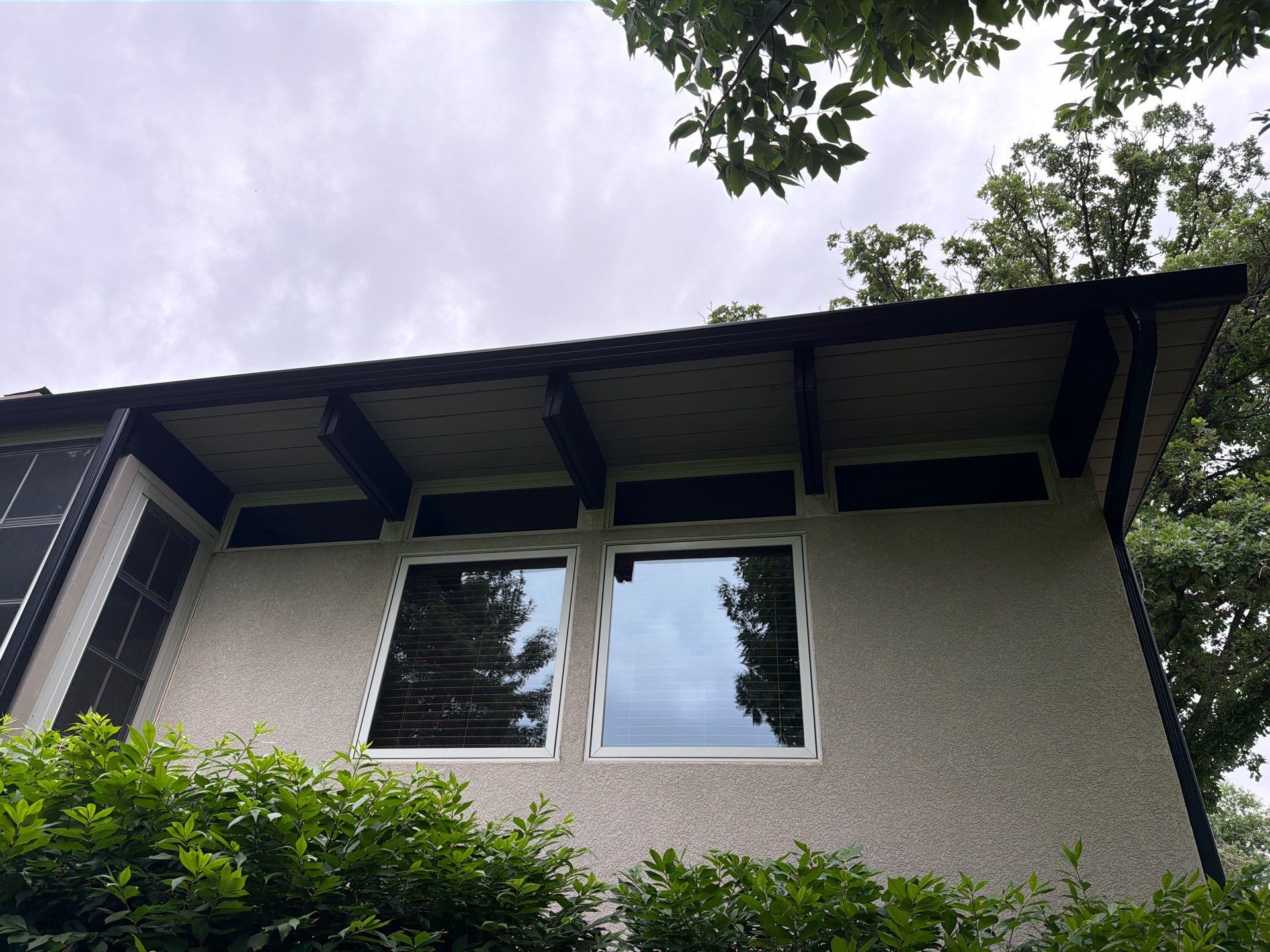 Exterior Trim Painting and Rafter Staining in Sioux Falls by Select Painting, Coatings & Garage Cabinets