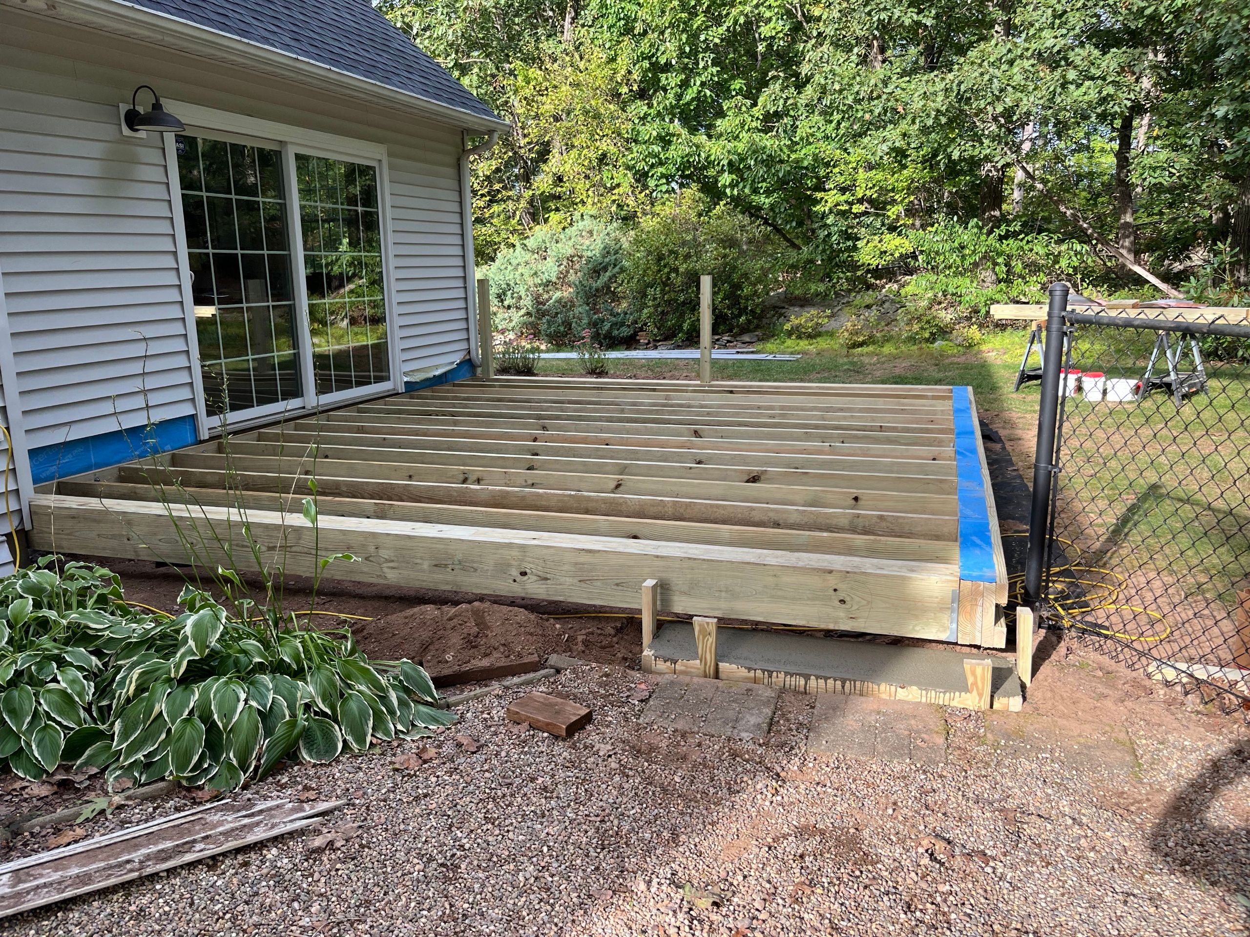 Deck replacement using Trex lineage Rainier and Black and White Transcend railings by DiGiorgi Roofing and Siding Inc
