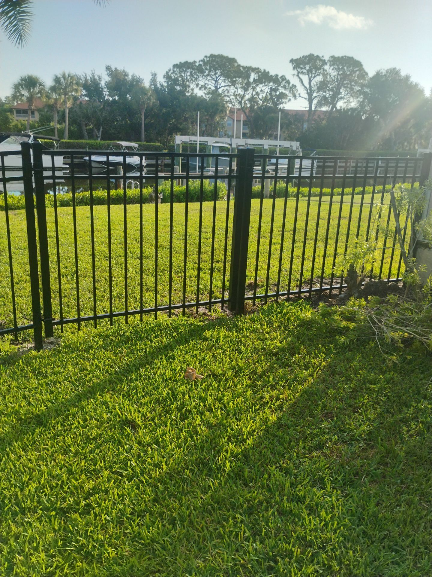 Black Aluminum Waterfront Fence Installation in Osprey by True Fence LLC