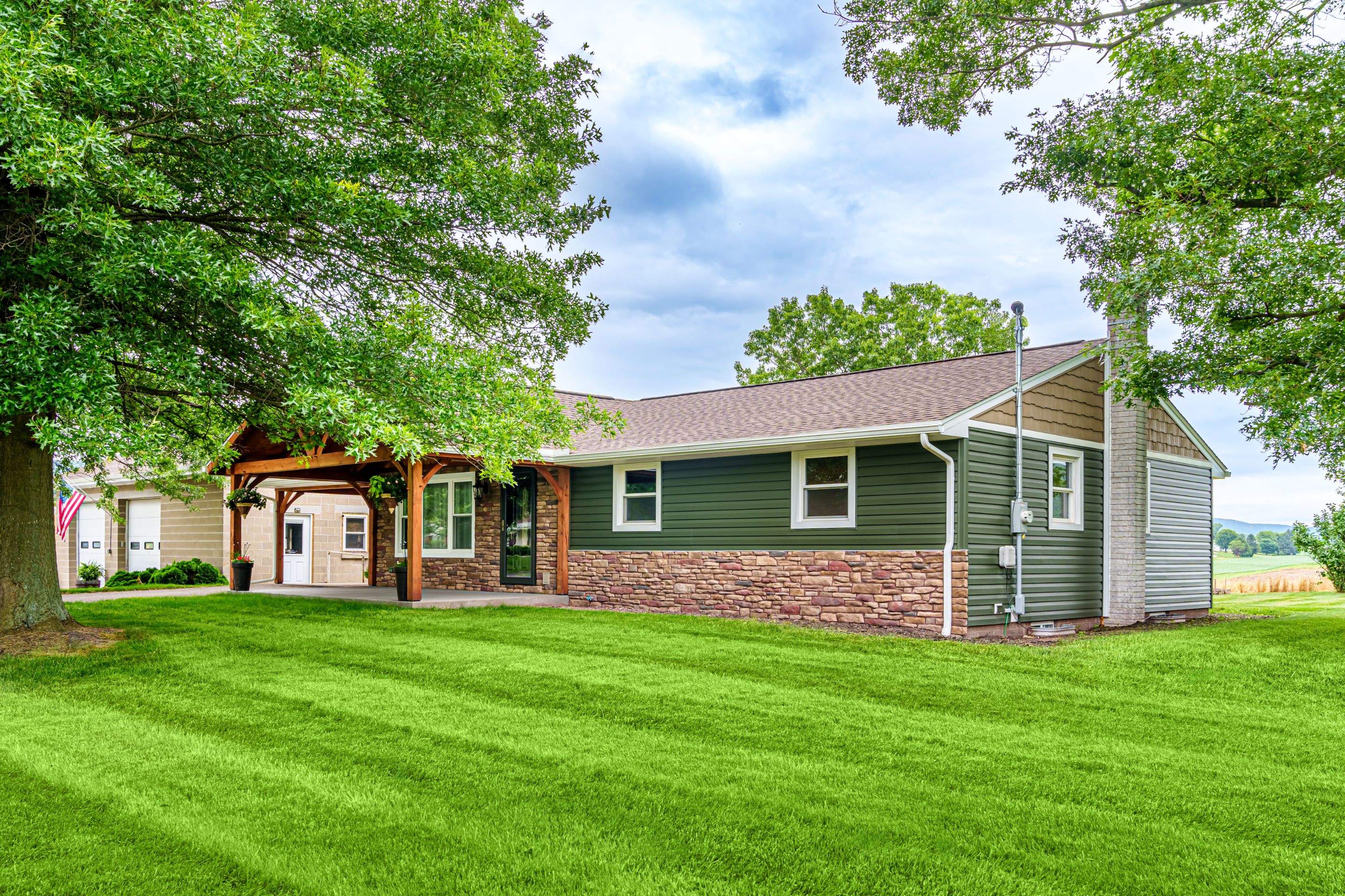 Shingle Roof- new siding- entry door by Esh Builders