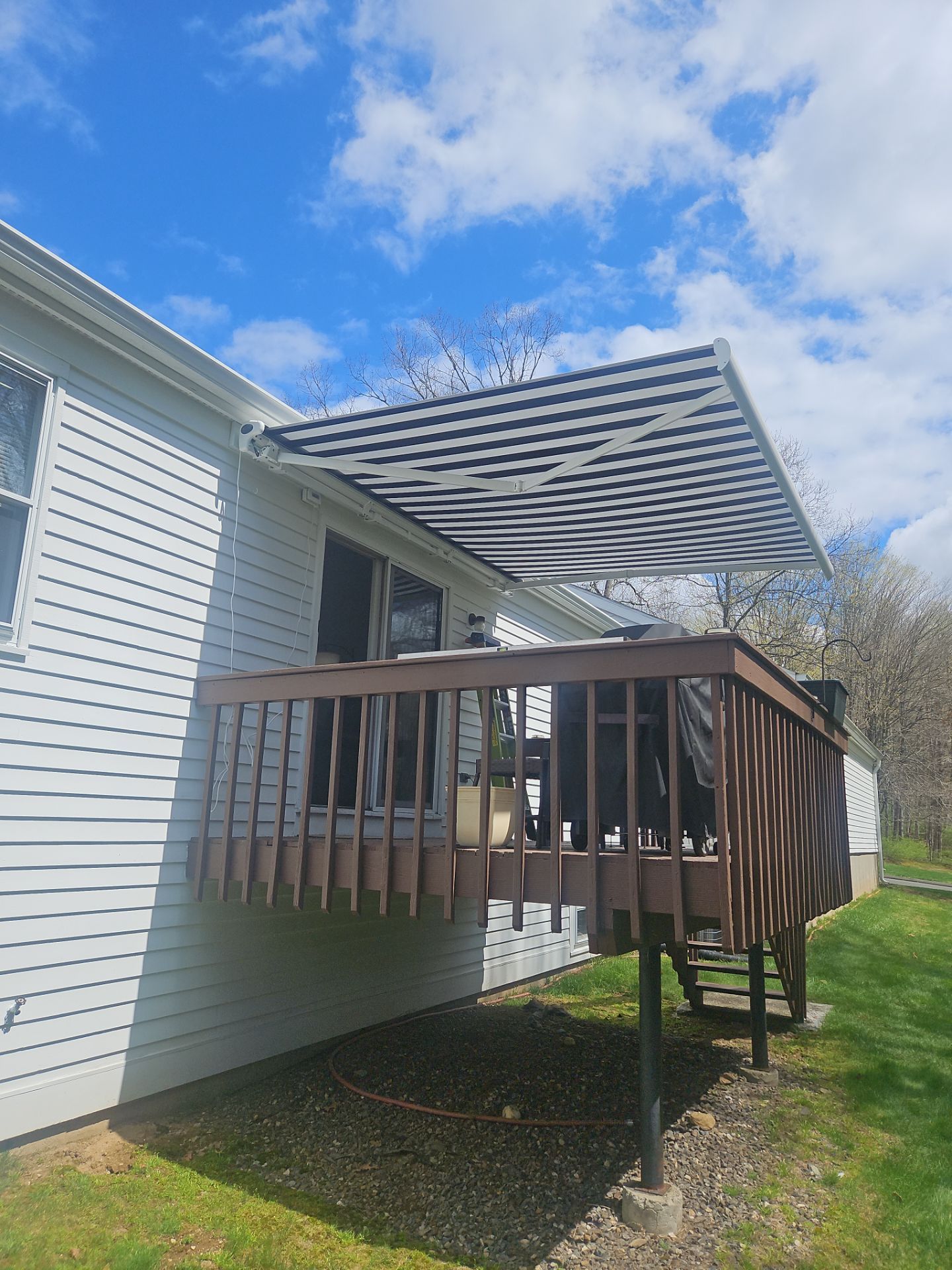 Retractable Awning Installation & Exterior Upgrade by DiGiorgi Roofing and Siding Inc