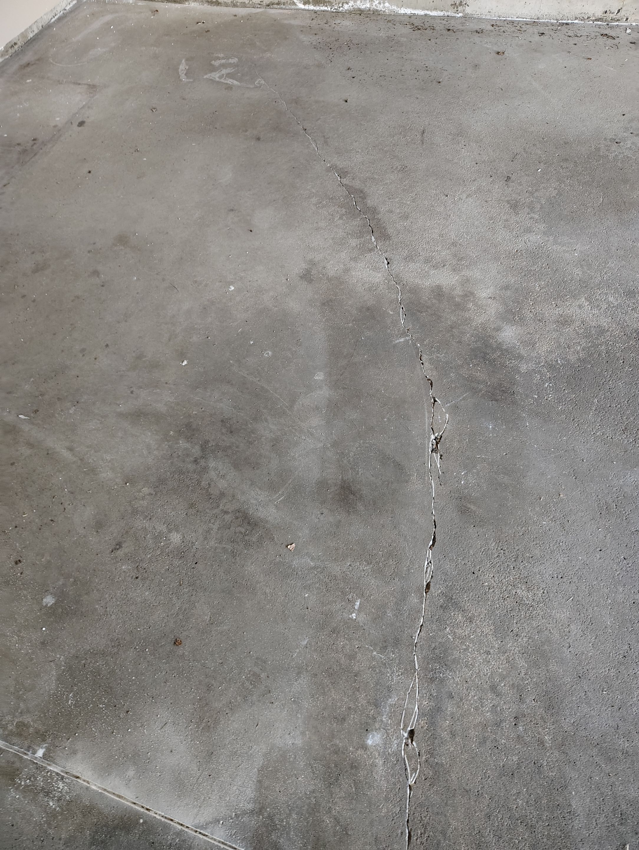 Sioux Falls Garage Concrete Repair and Epoxy Flake Floor Coating by Select Painting, Coatings & Garage Cabinets