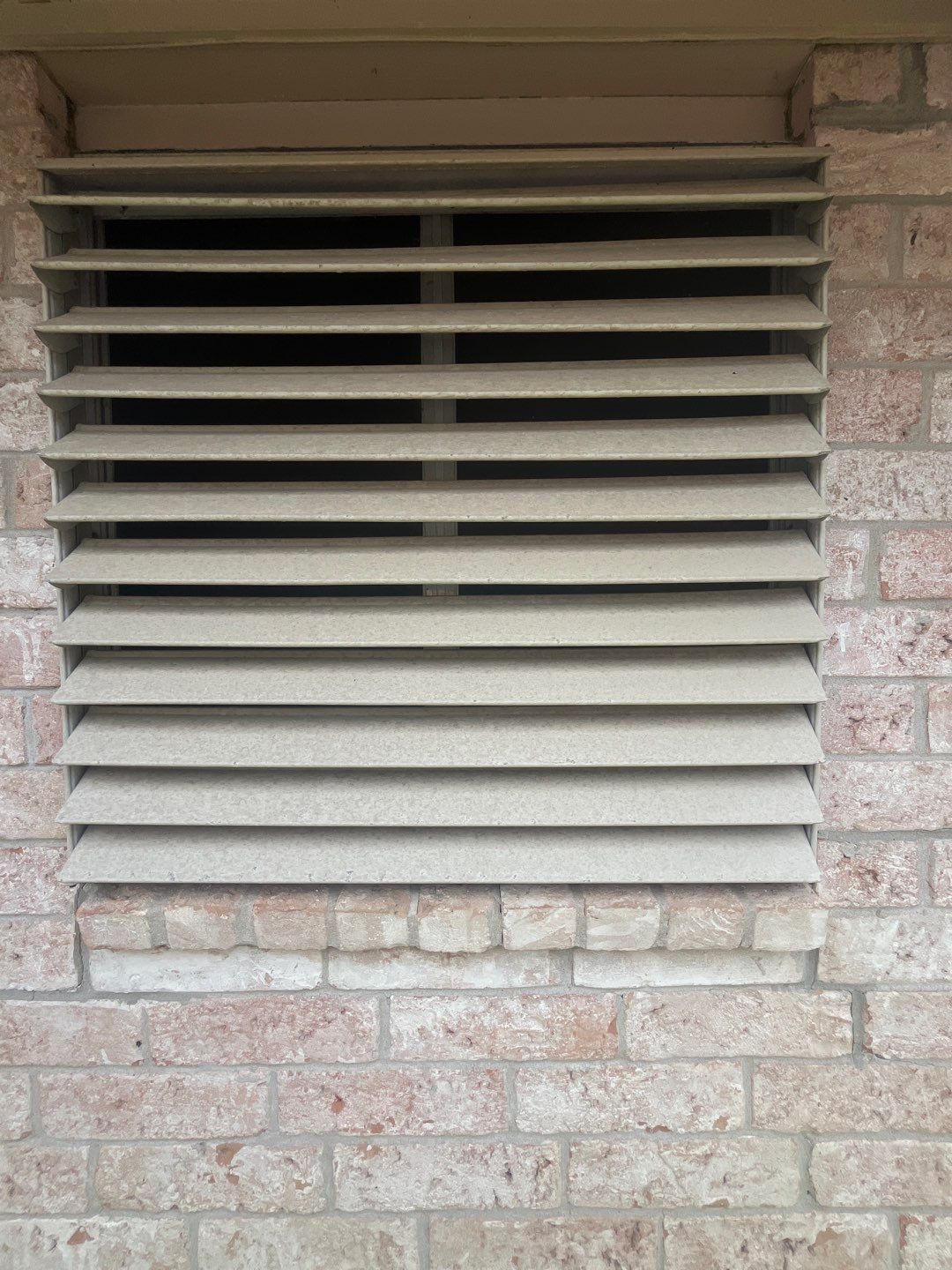 Colored Vinyl Windows to blend into brick by Bayfront Roofing and Construction