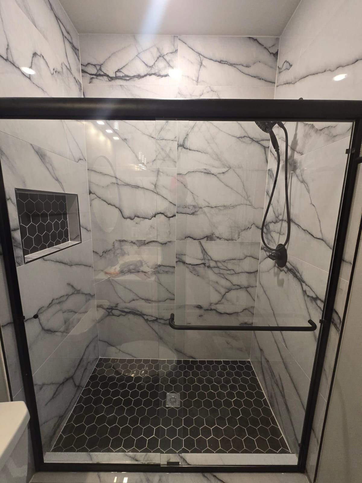 Tub to walk-in shower conversion by Prudencio