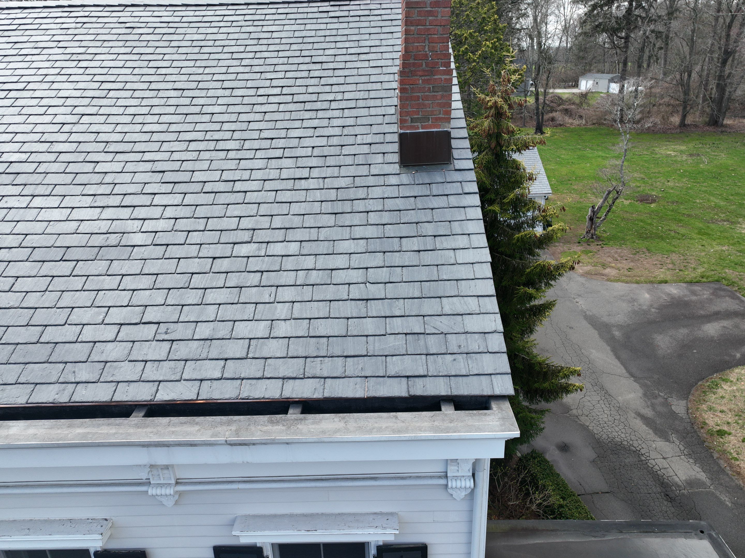 Residential Roofing Installation using Vermont Slate by A Plus Exterior