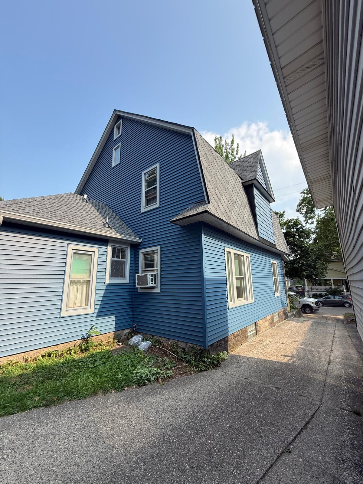 SIDING, DECK AND NEW PORCH  by Avalon Roofing and Exteriors
