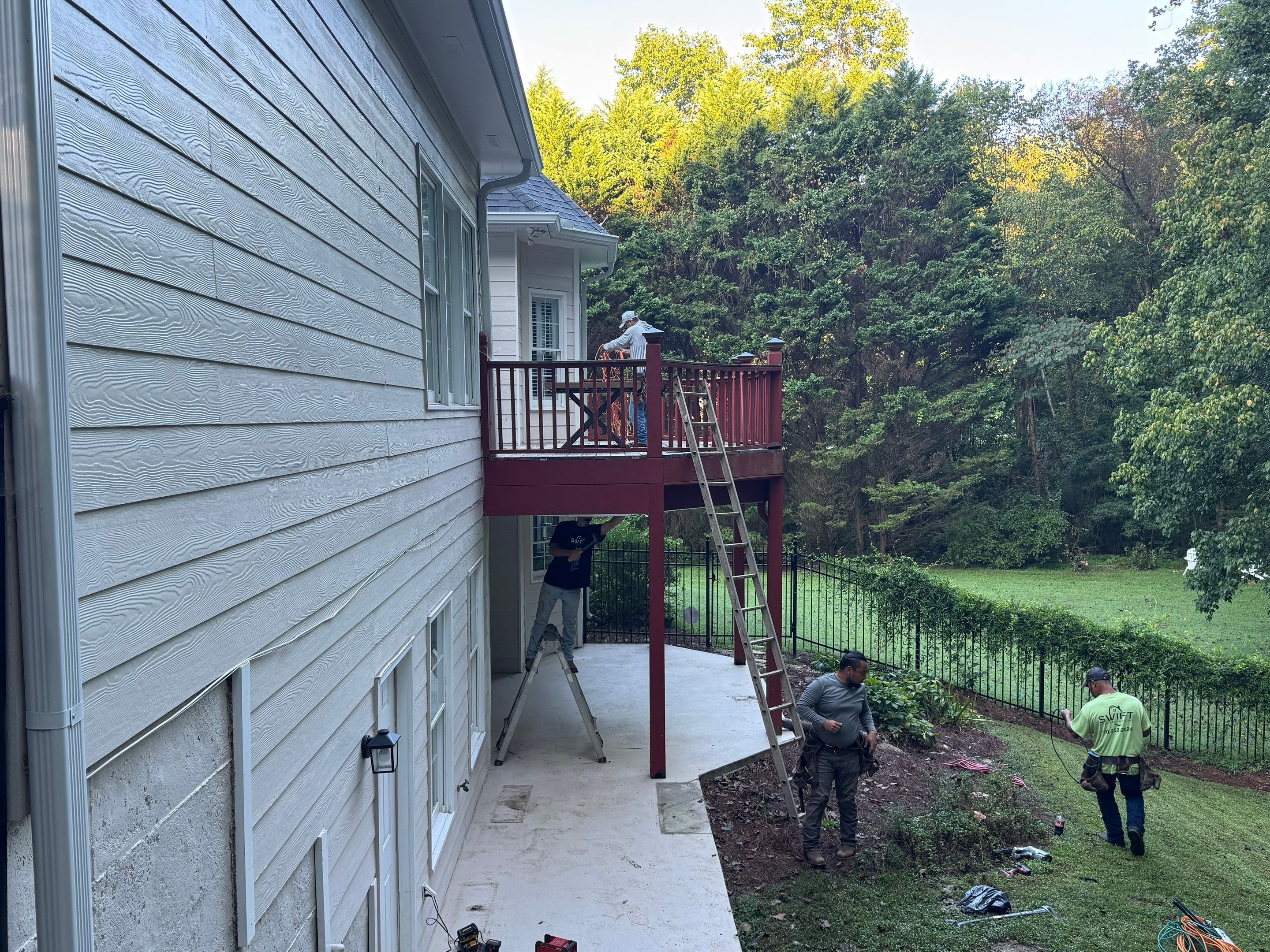 Elevated Composite Deck Replacement with Metal Railings in Smyrna by Swift Home Renovations 