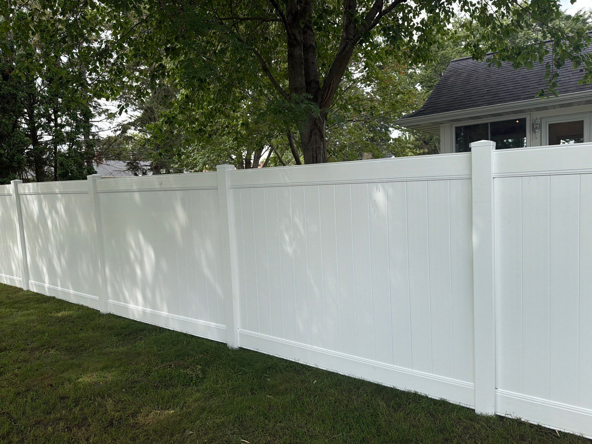 Residential White Vinyl Privacy and Black Chain Link Fencing in Jesup by Perfect Picket Fence and Stain
