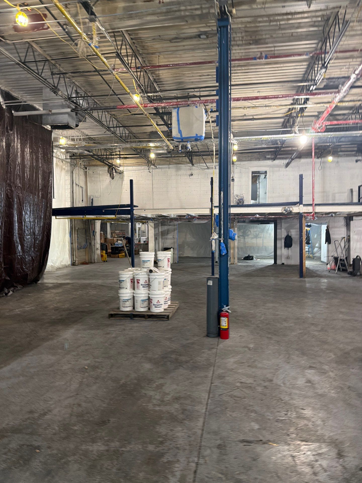 Industrial Warehouse Fire Damage Cleaning and Spray Sealing in Islandia by EMS Restoration Corp