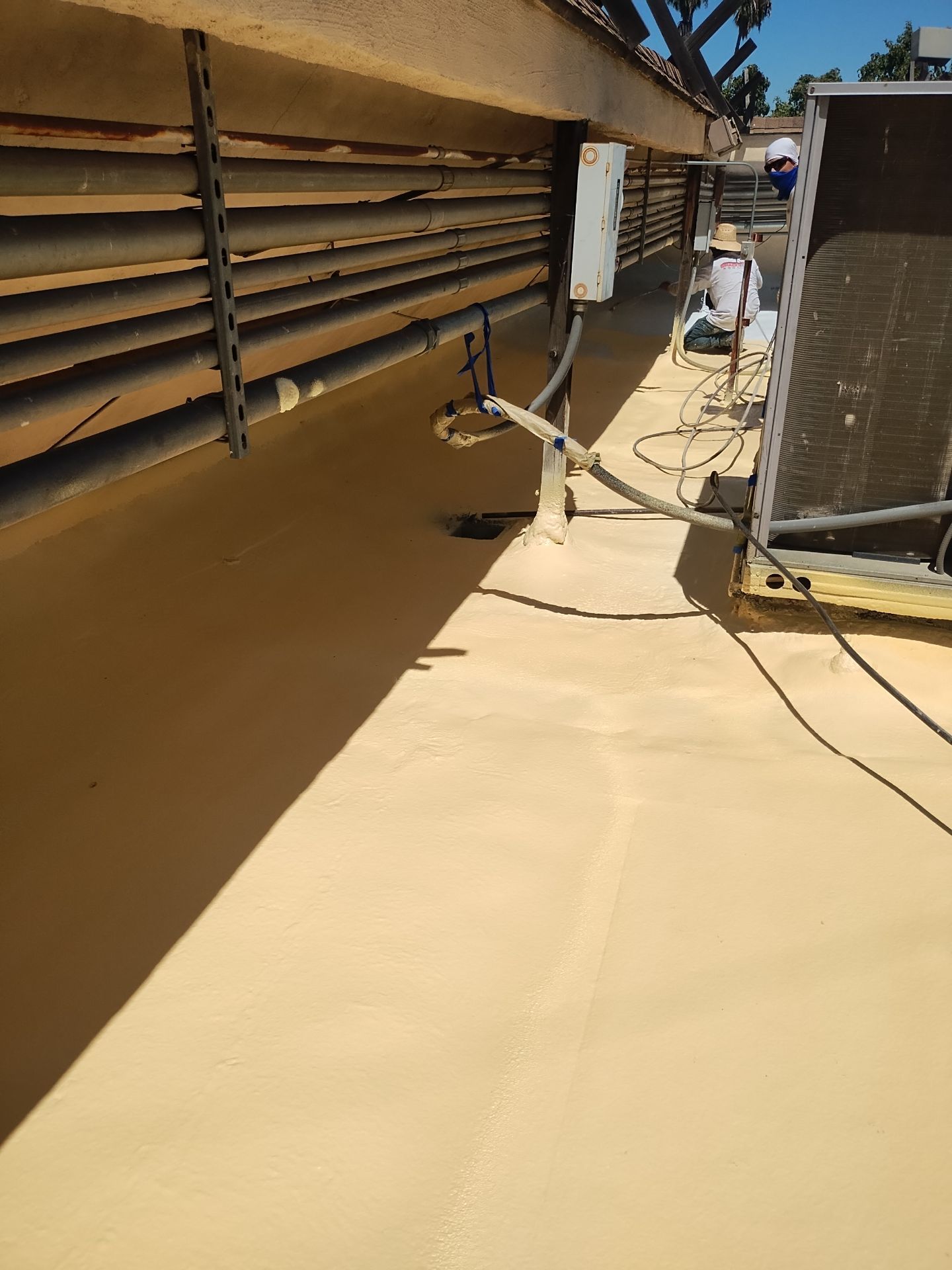 Spray foam and coatings using General Coatings acrylic coatings and spray foam by Straight Edge Roofing Inc
