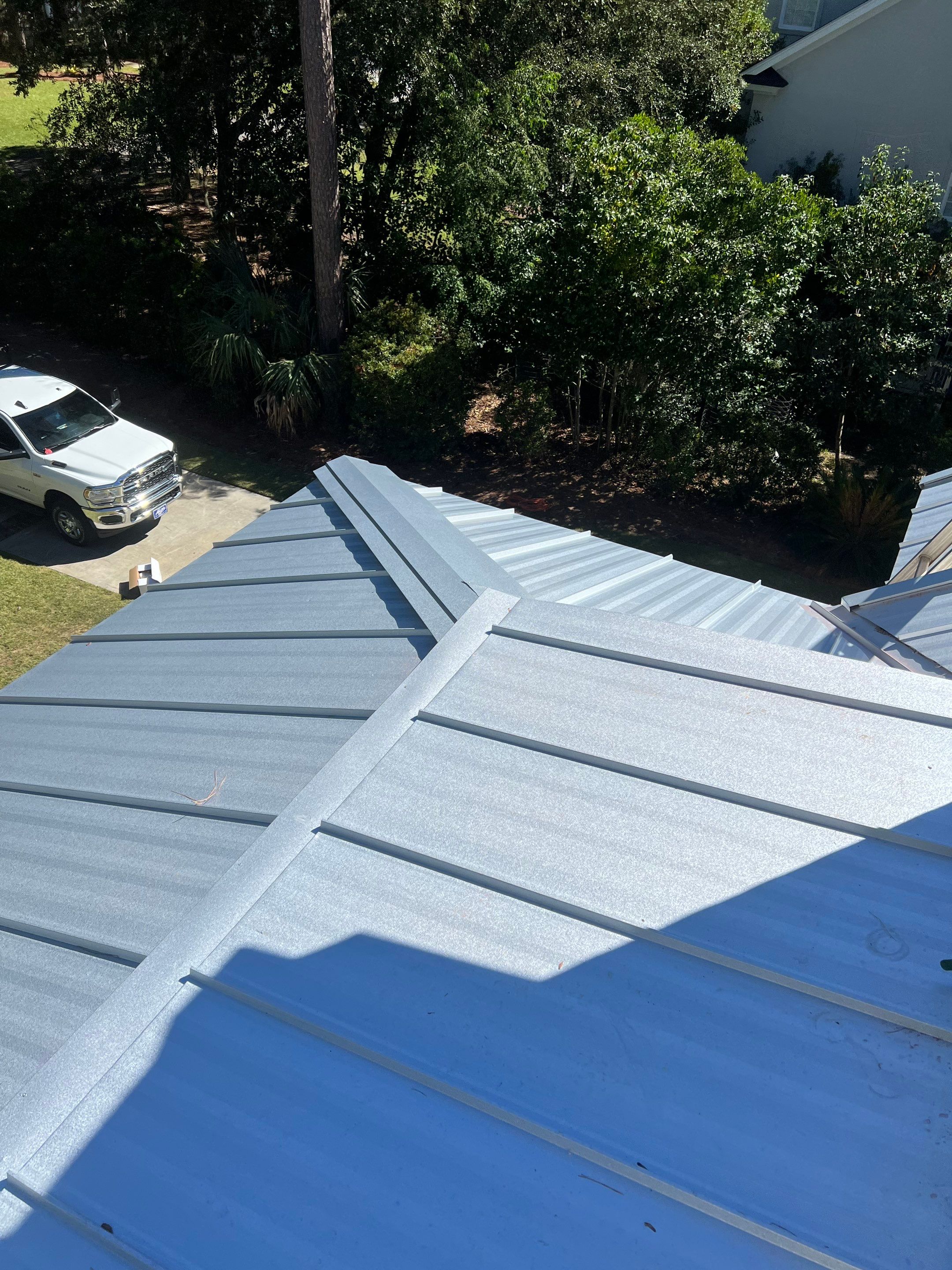 Roof Replacement using Standing Seam Metal by Rainstoppers Roofing