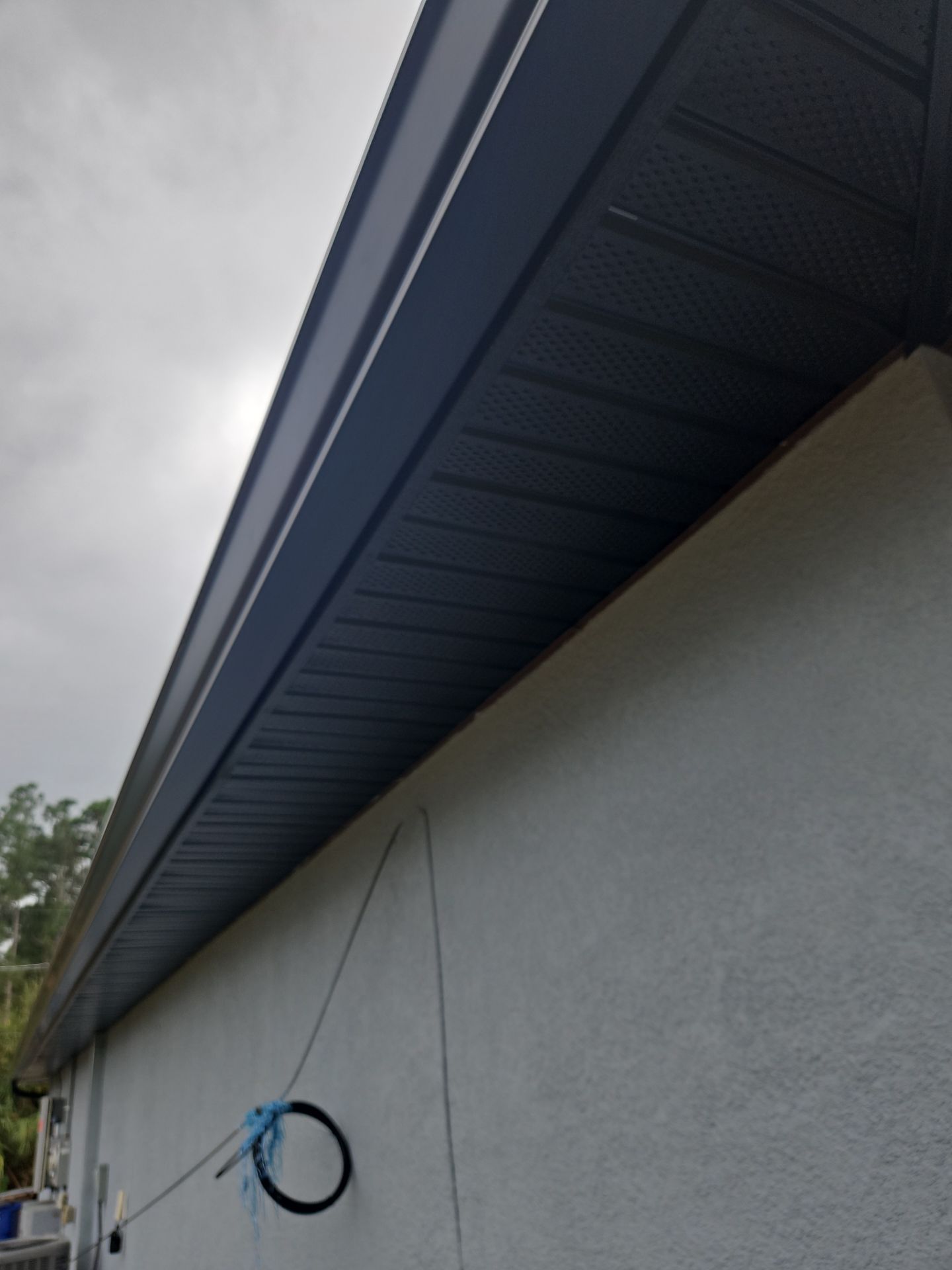 Black Seamless Gutters & Soffit/Fascia in Lehigh Acres FL by Gutter Professors