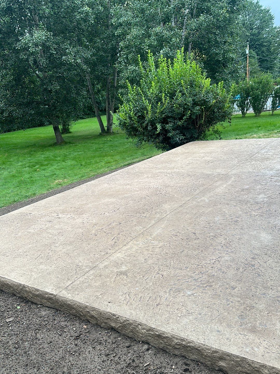 Bluestone textured stamped concrete patio by NG Masonry & Construction LLC