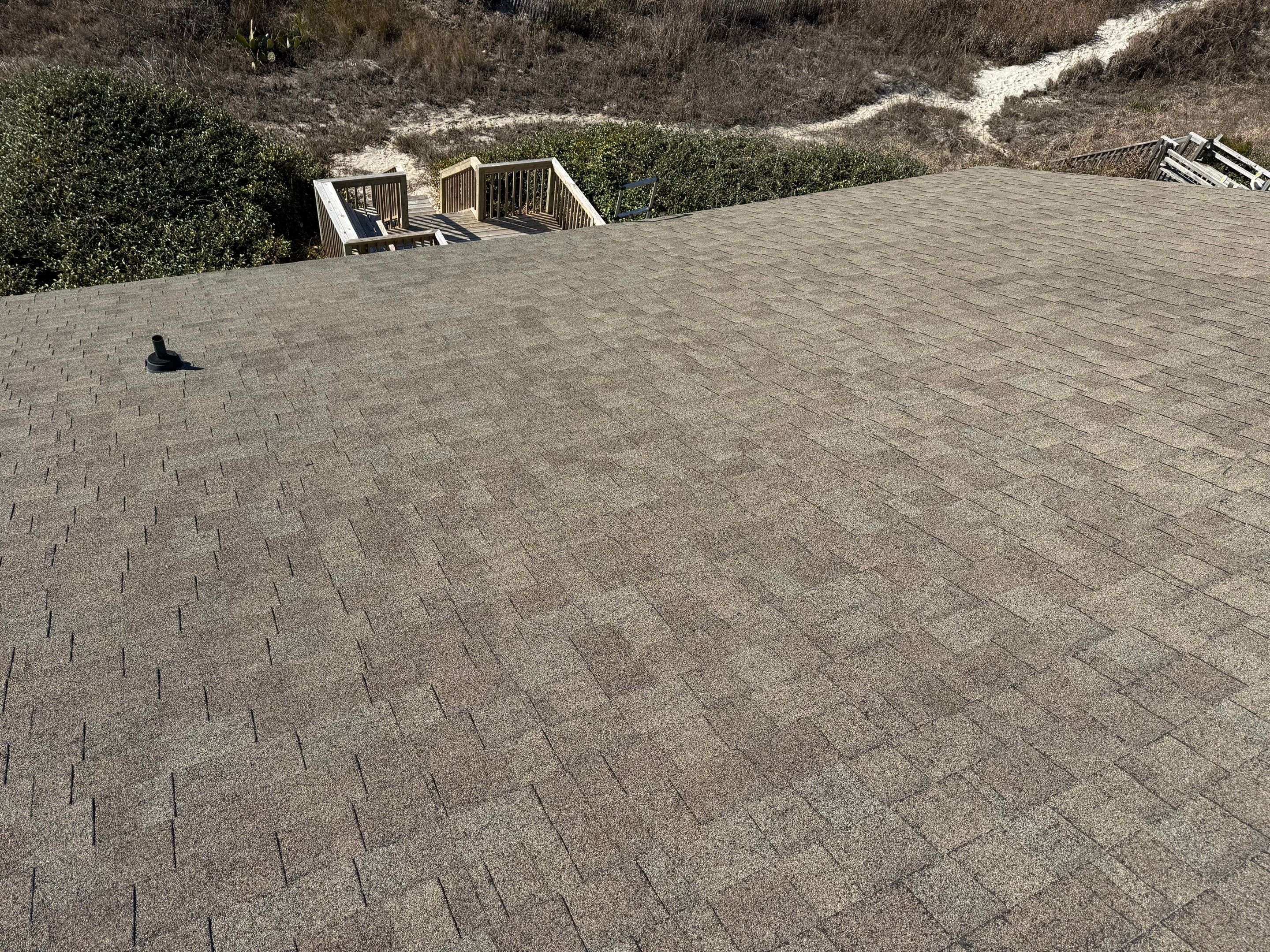 Coastal Blue Roof Replacement in Oak Island, NC by RGR Construction and Roofing, LLC