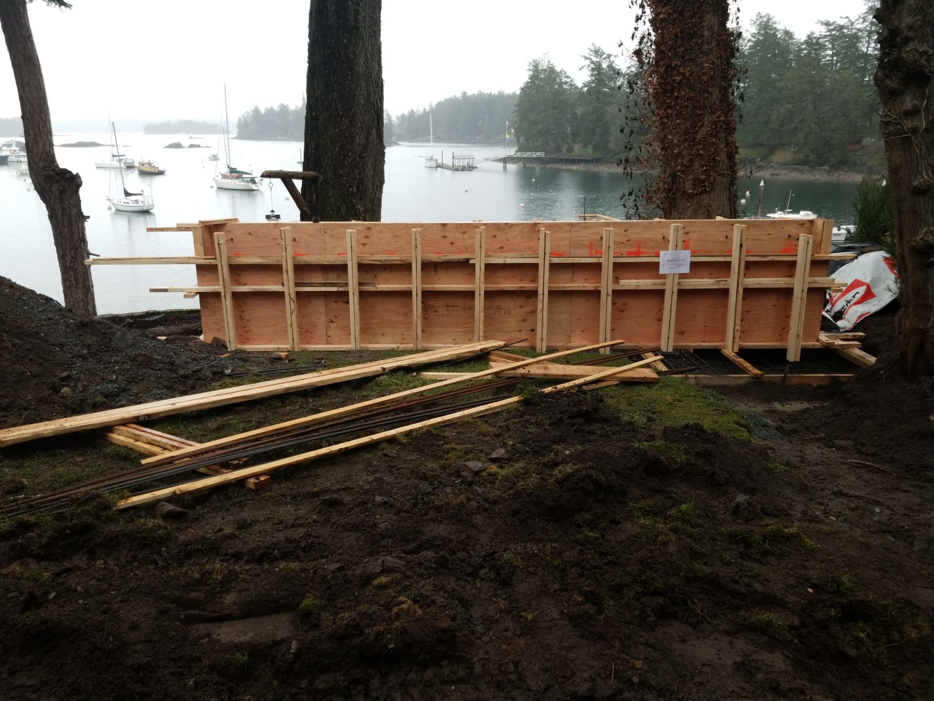 Coastal Landscape Restoration & Retaining Structure - In progress by Habanero Garden and Exterior Care