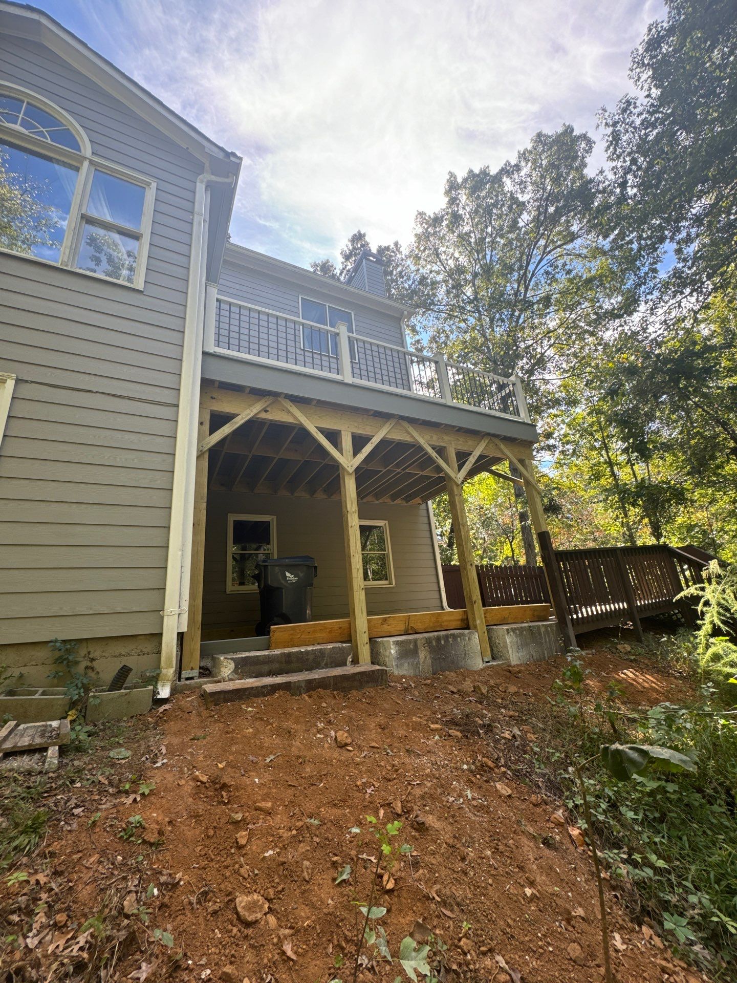 Elevated Deck Replacement with White Railings in Kennesaw by Swift Home Renovations 