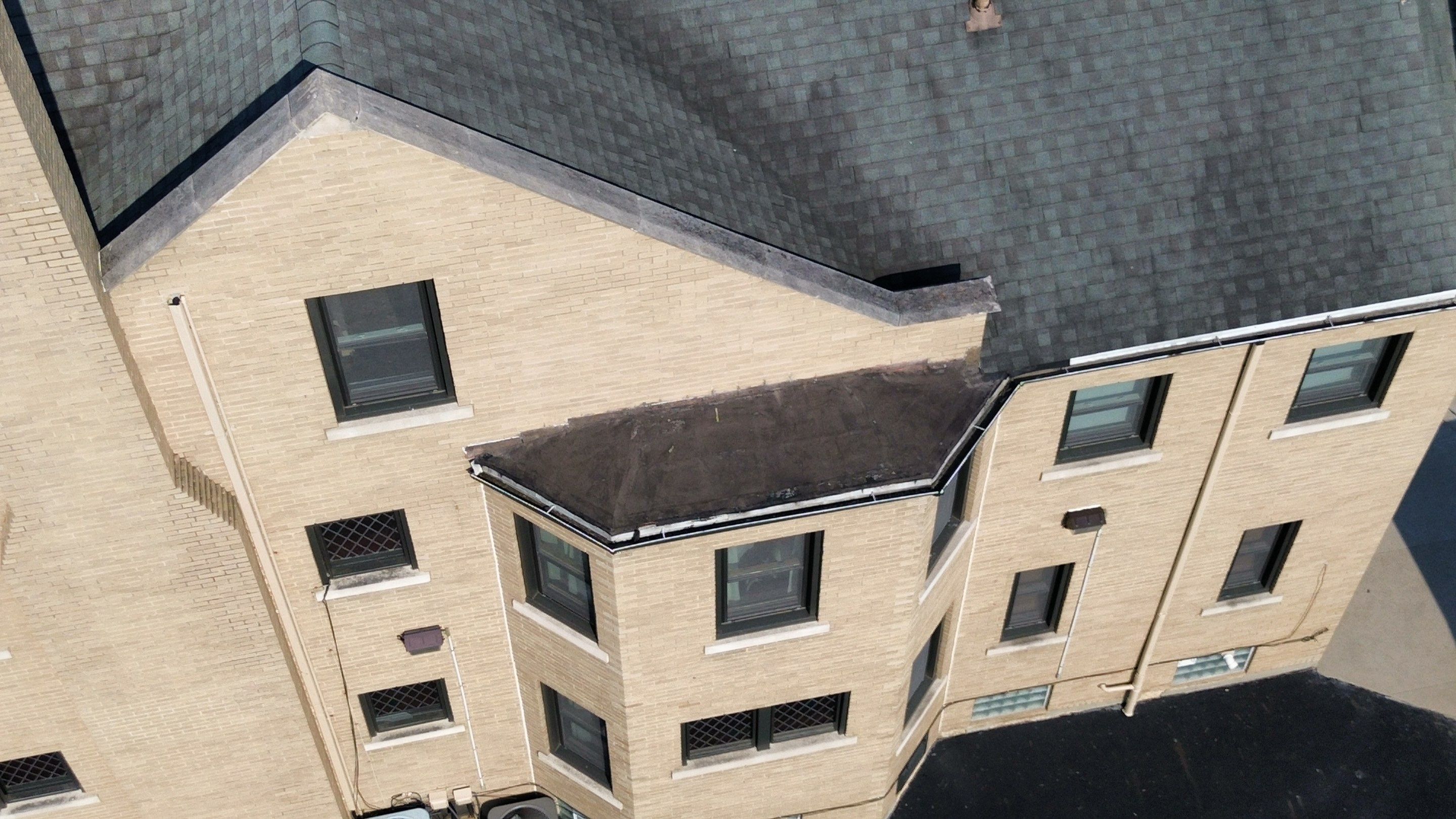 Commercial Roofing Installation using Standing Seam Metal - Frost Black by RoofX 