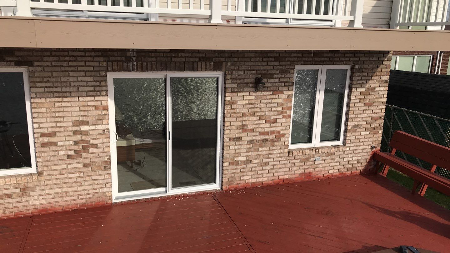 Deck Refurbush and Door Replacement using Trex Decking and Railing. Polaris Patio Doors by Secure Construction Company Inc